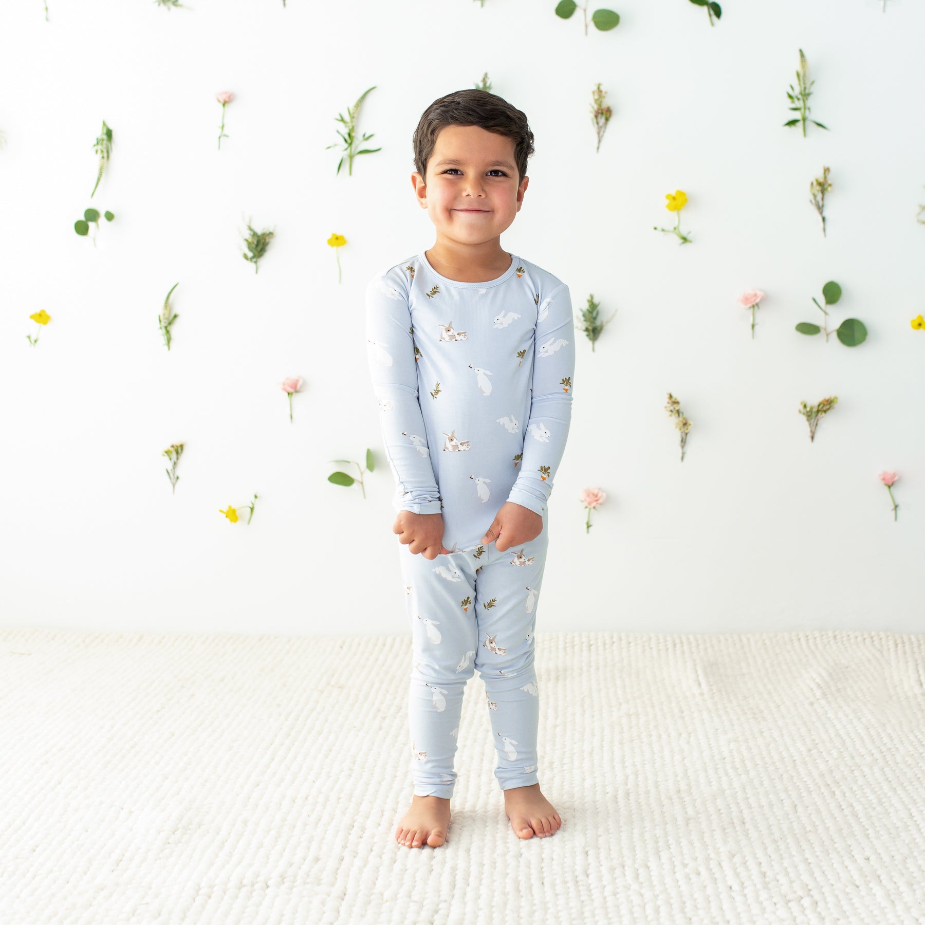 Toddler modeling Long Sleeve Pajamas in Ice Rabbit