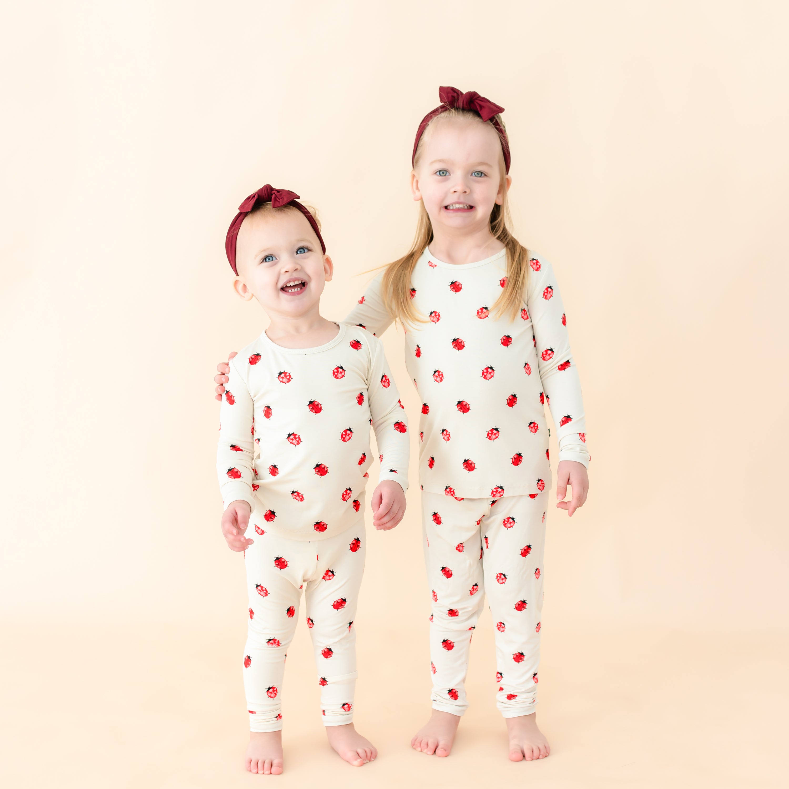 Toddlers modeling Love Bug long sleeve pajamas