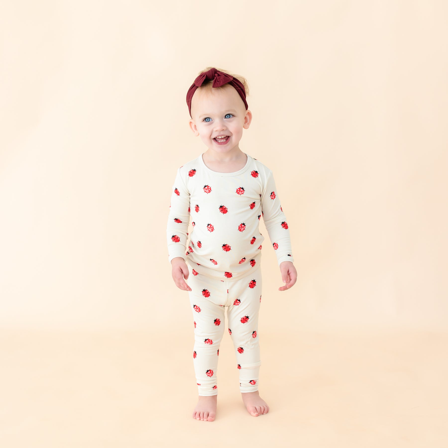 Toddler modeling Love Bug long sleeve pajamas