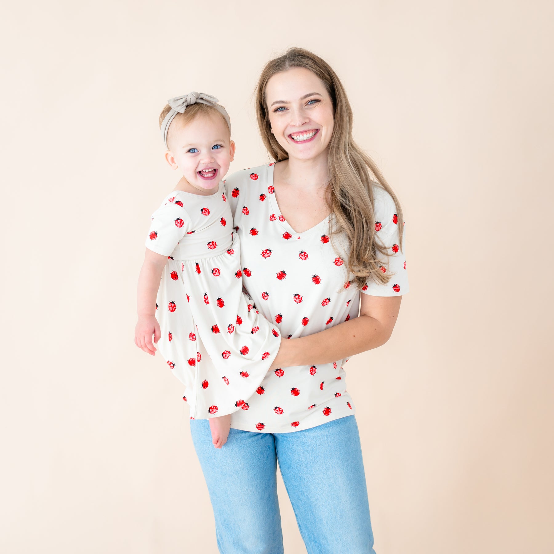 Toddler and mom wearing Love Bug twirl dress and v-neck tee