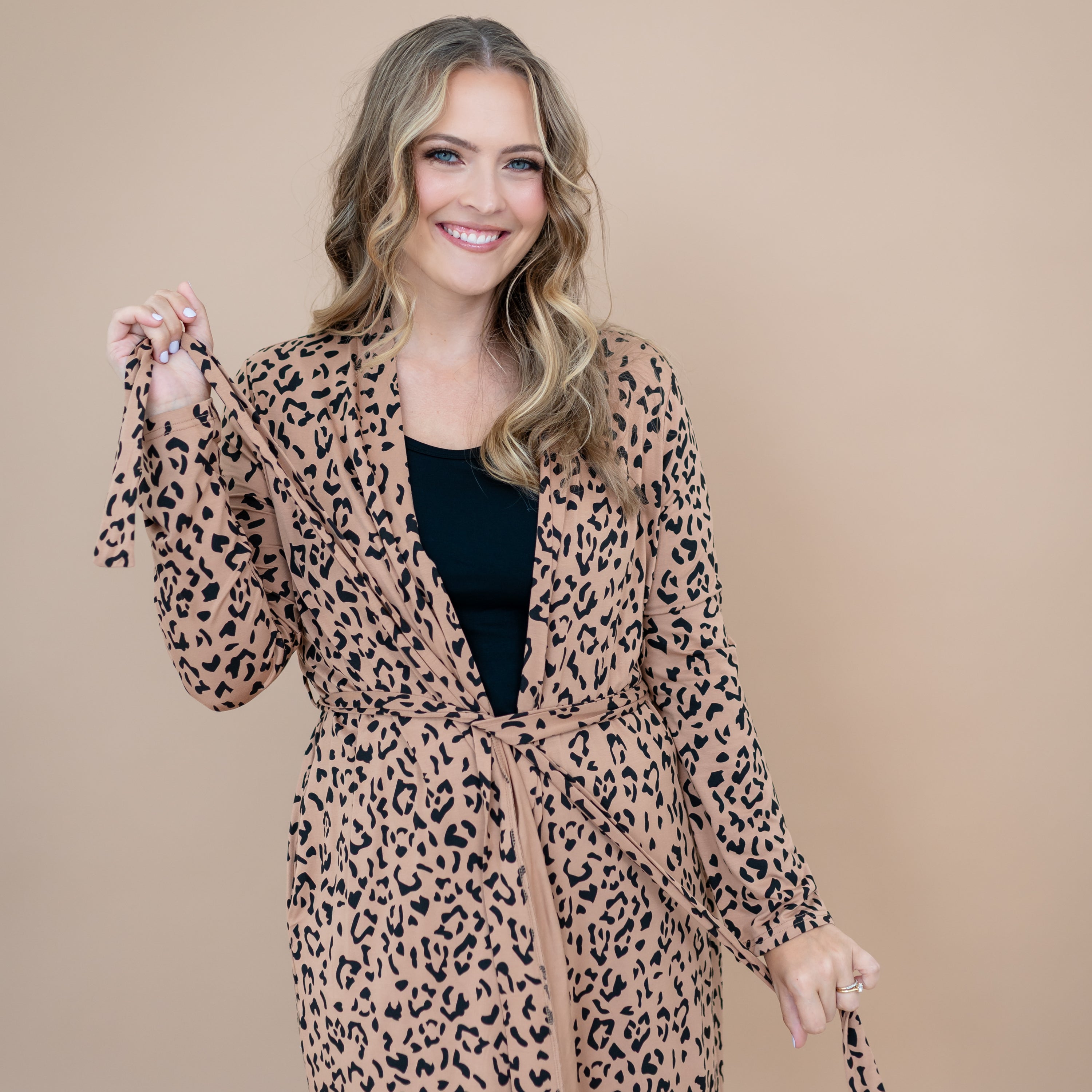 Close up of the tie waistband of the Women's Lounge Robe in Latte Leopard shown on a model