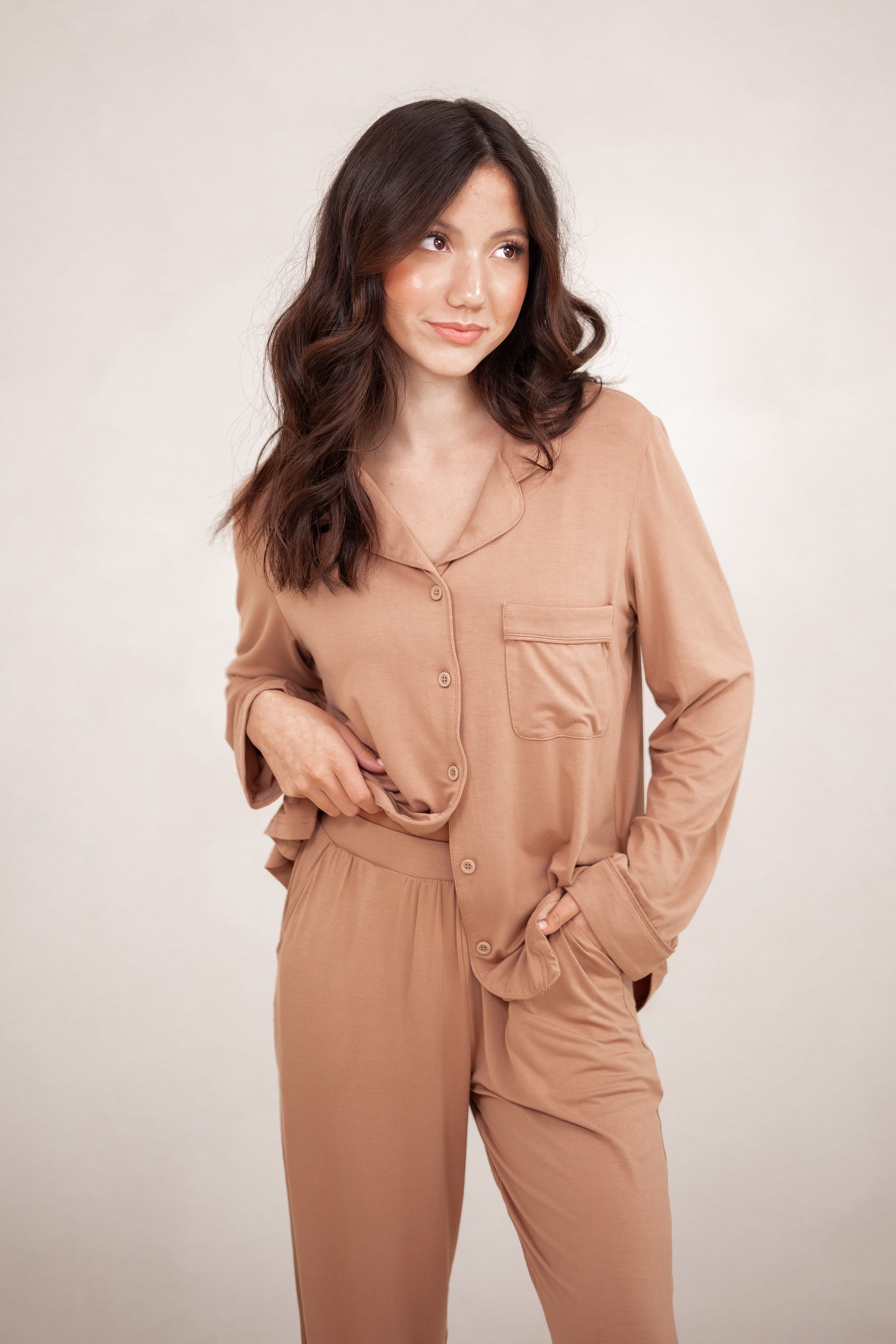 Close up of the shirt of the Long-Sleeved Women's Pajama Set in Latte with Latte Trim shown on a model