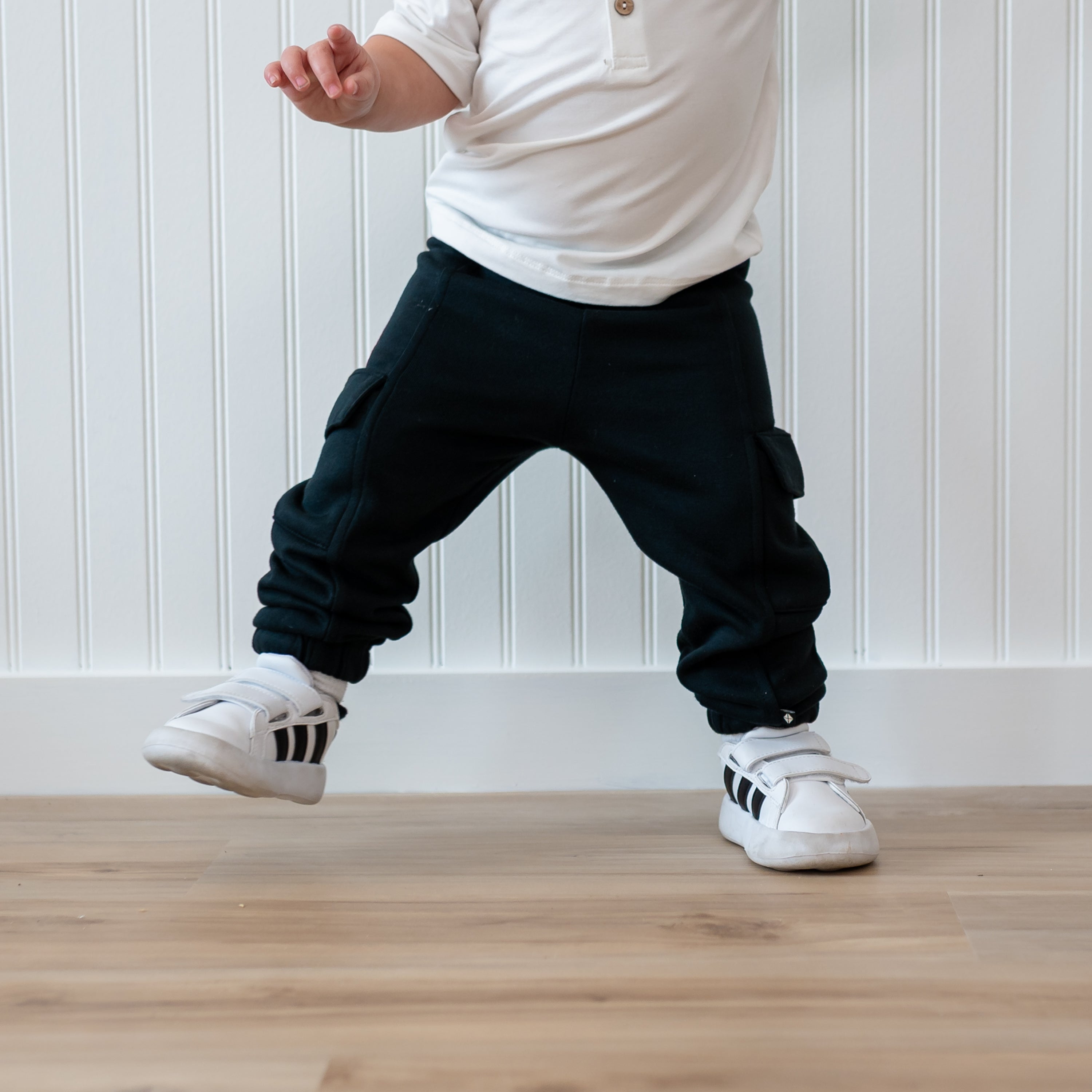 Fleece Cargo Pants in Midnight shown on a walking toddler