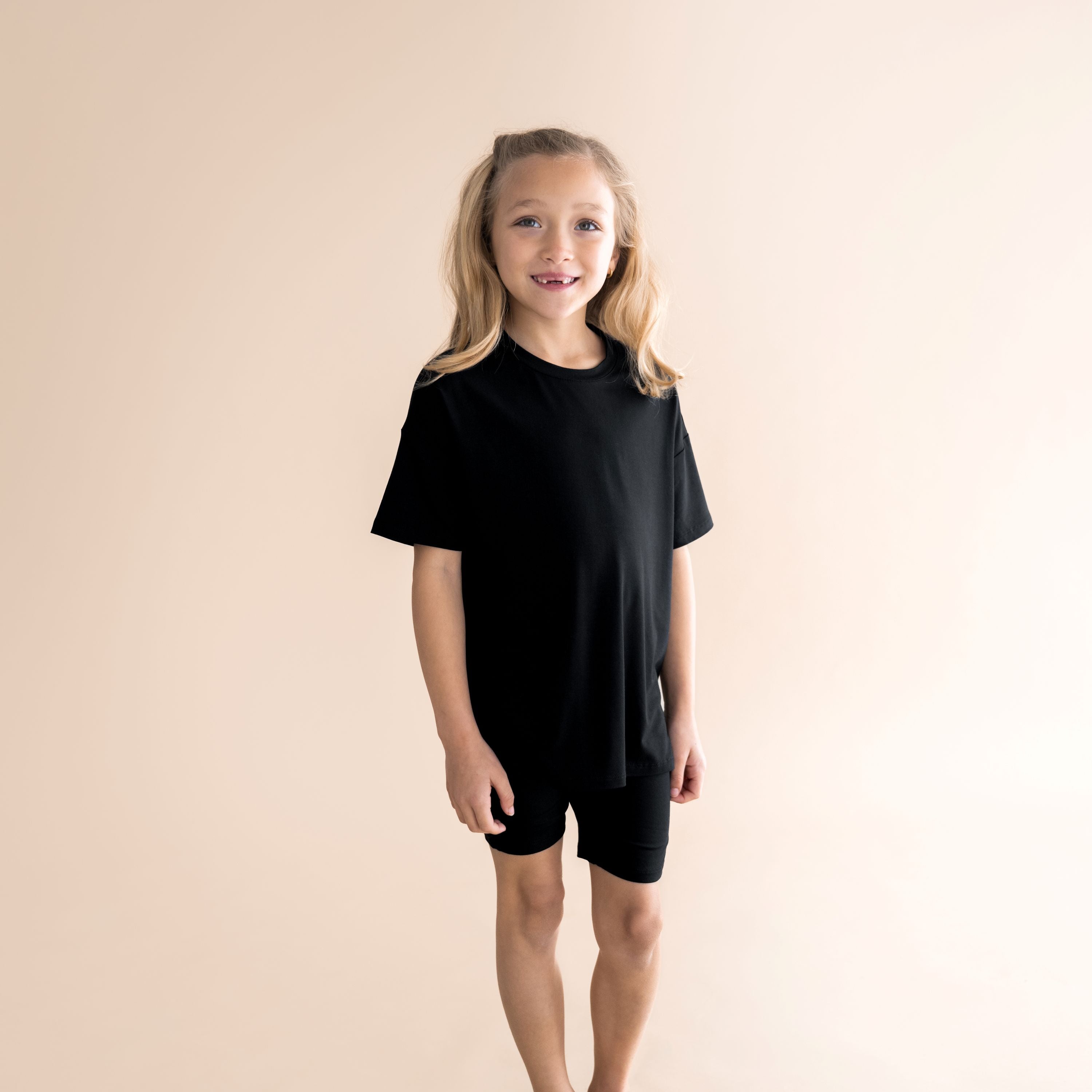 Young girl modeling the Toddler Biker Short Set in Midnight