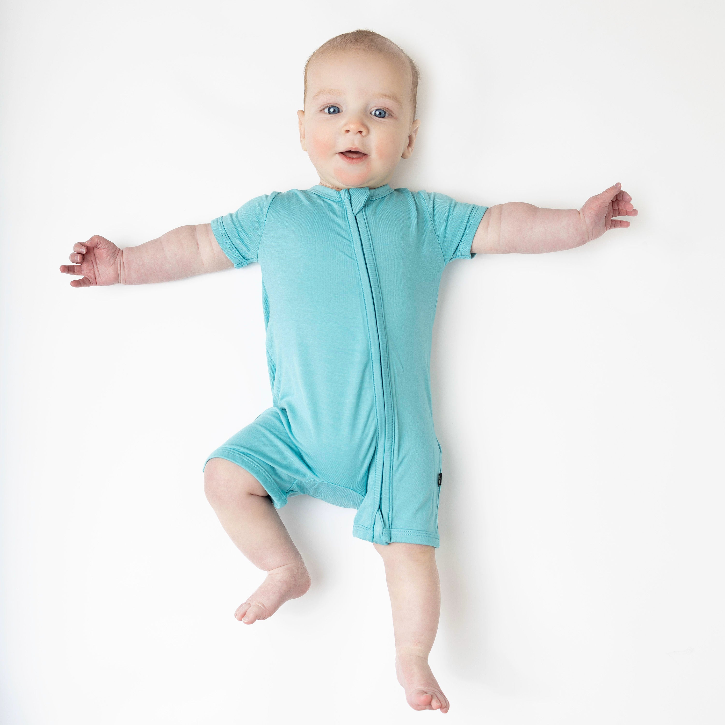 Baby in Zipper Shortall Romper in Makai 