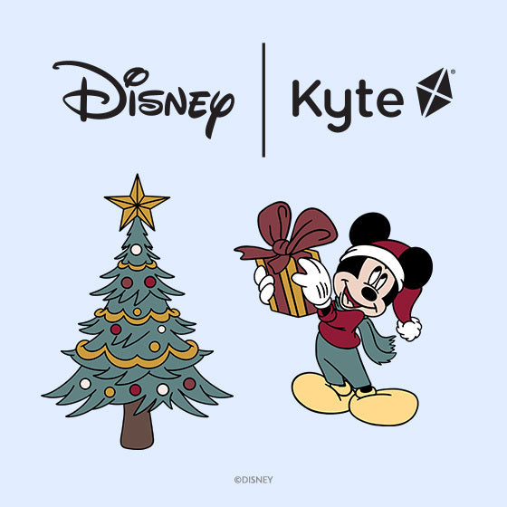 Disney | Kyte logo with christmas tree and mickey mouse elements on a blue background