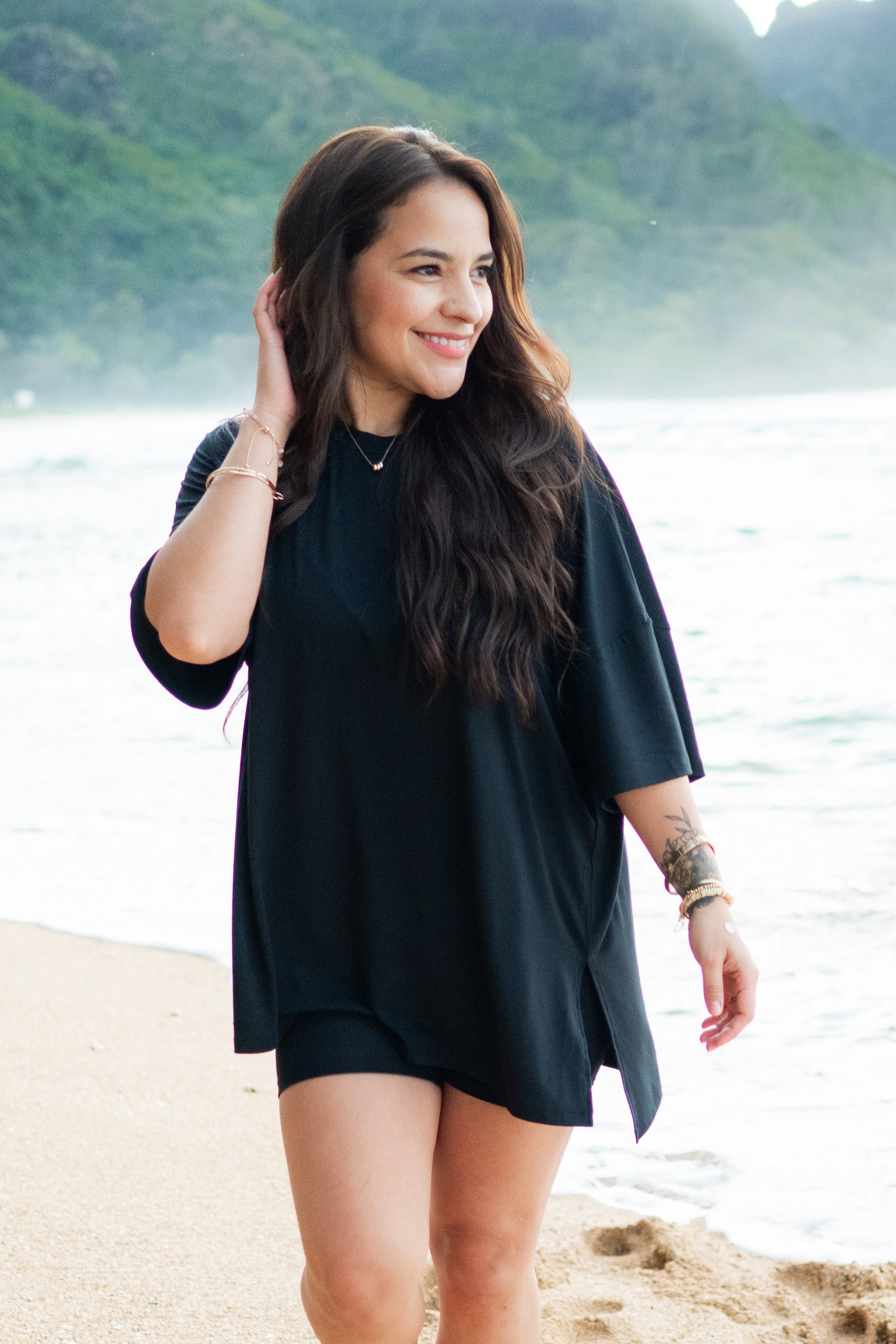 Woman modeling Women’s Biker Short Set in Midnight on beach