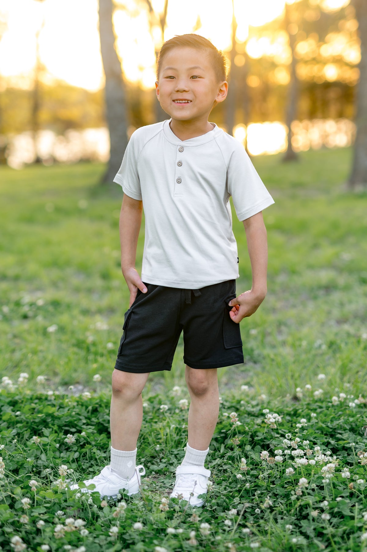 Young boy wearing the Cargo Short in Midnight with a white short sleeve henley