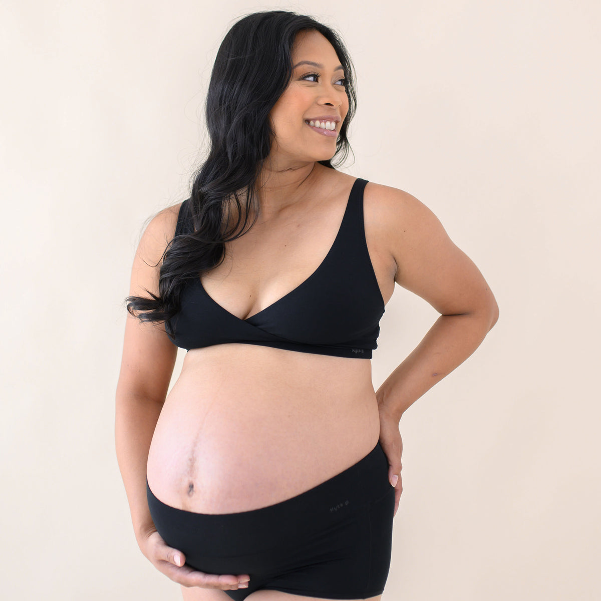 Pregnant woman modeling Women's High-Waisted Brief in Midnight