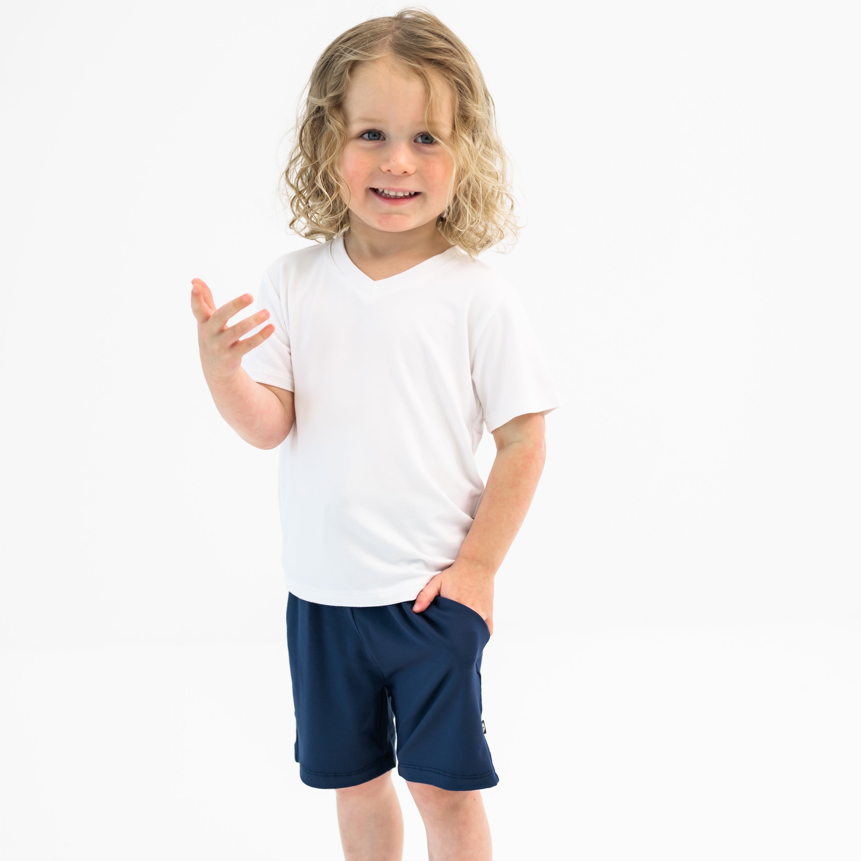 Toddler modeling Drawstring Short in Navy and Snow V-neck