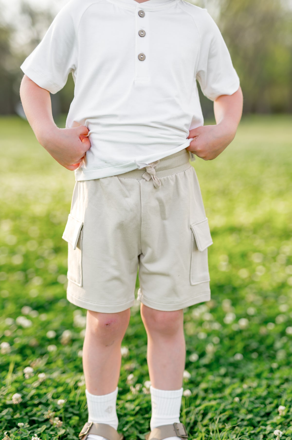 The front of the Cargo Short in Oat  showing the waistband on a model