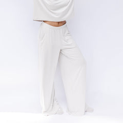 Women's Wide Leg Pant in Oat shown on a model in front of a white backdrop