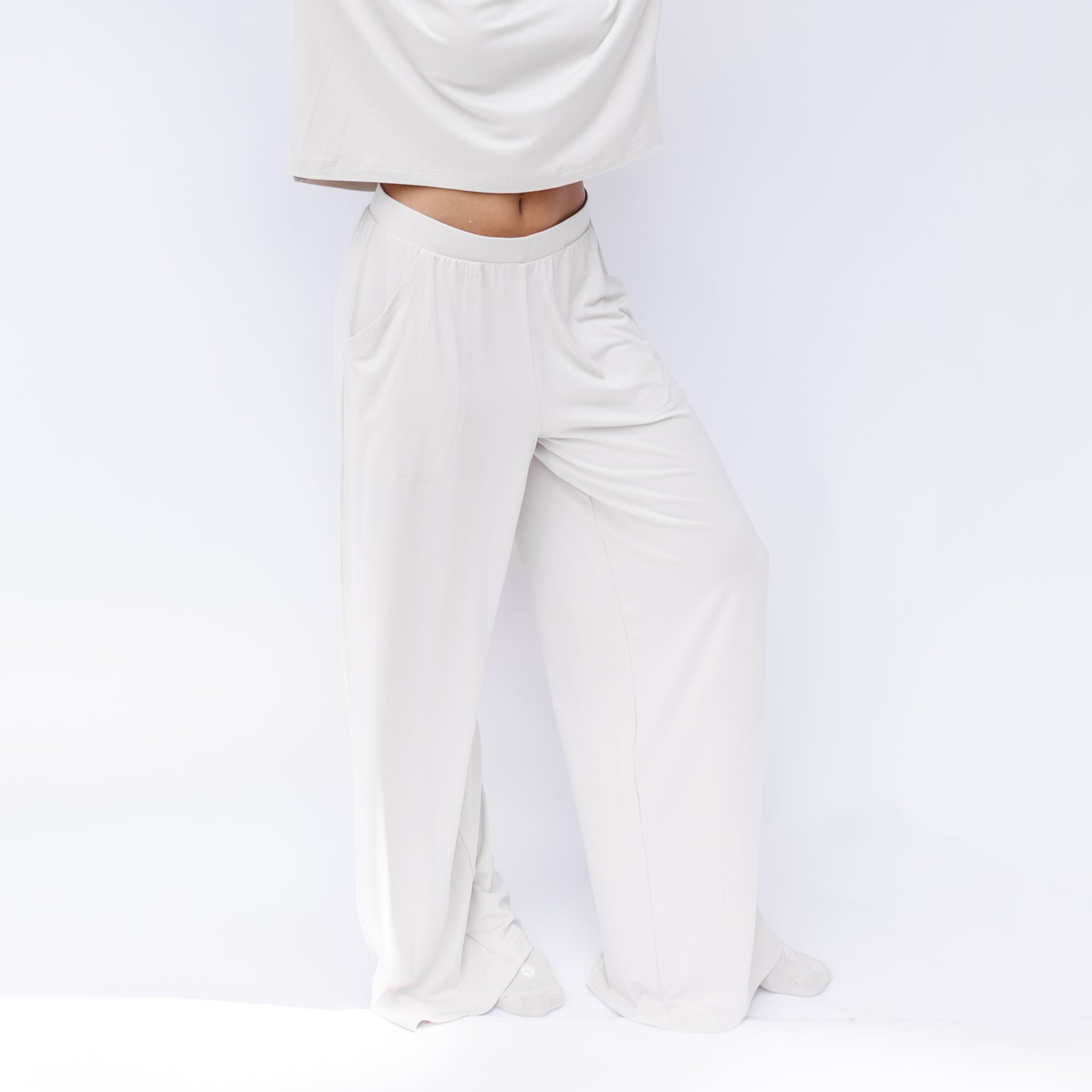 Women's Wide Leg Pant in Oat shown on a model in front of a white backdrop
