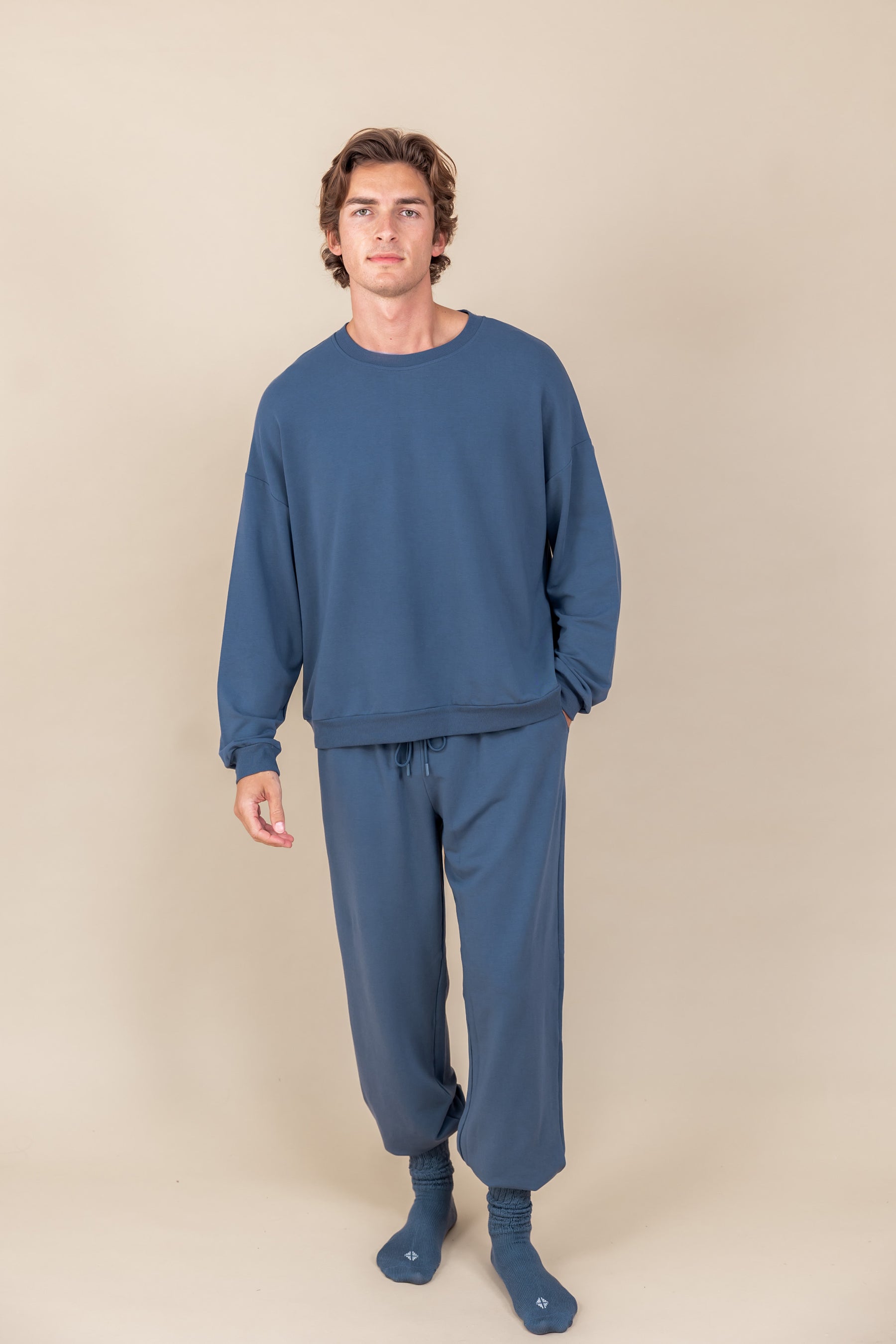 Modal wearing Adult Scrunch Socks in Oxford color while wearing oxford color jogger set on a beige background