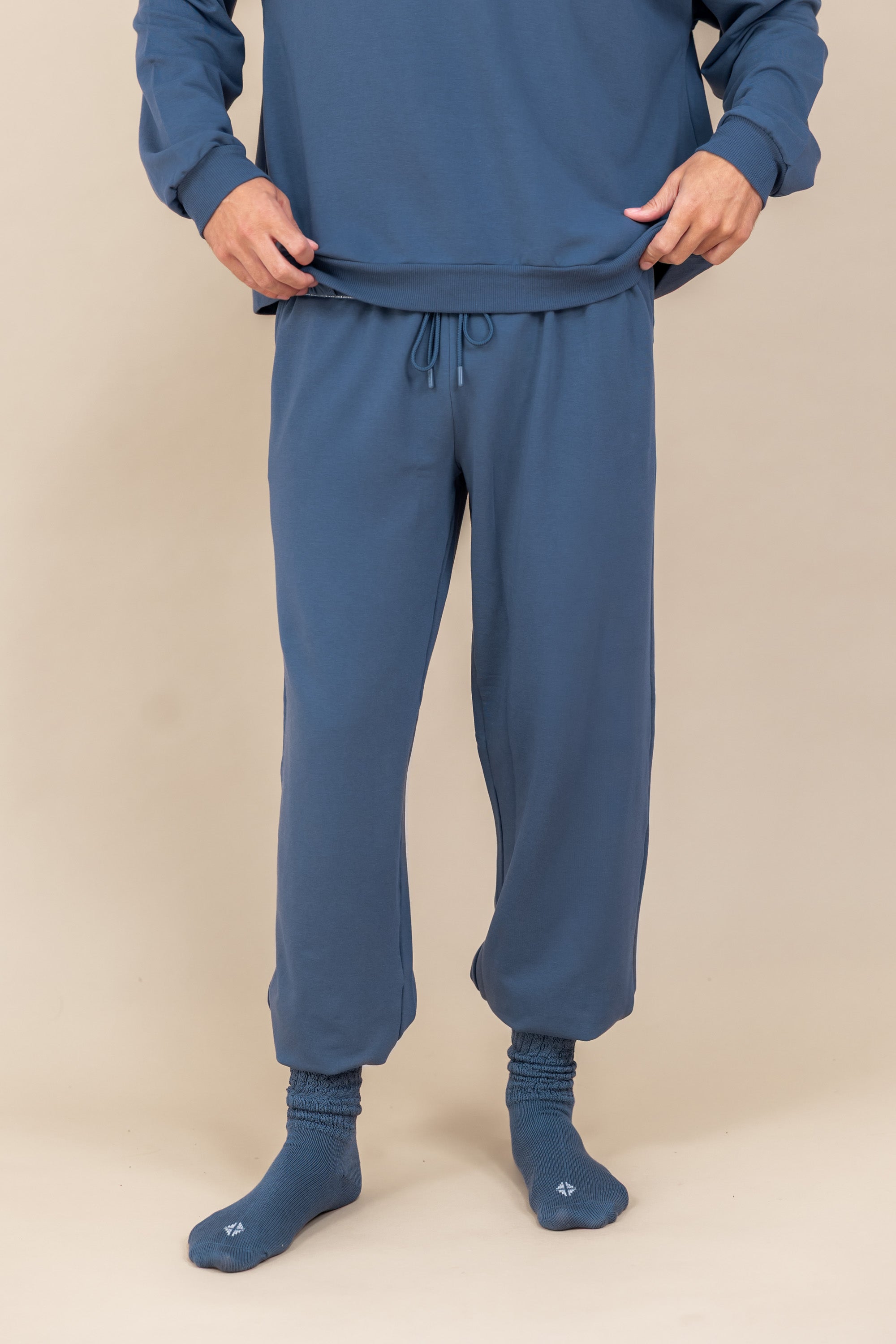 Modal wearing Adult Scrunch Socks in Oxford color over oxford color jogger set on a beige background