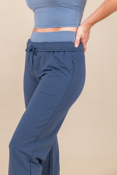 Modal wearing Women's Jogger Pants in Oxford color under similar color T-shirt on a beige background