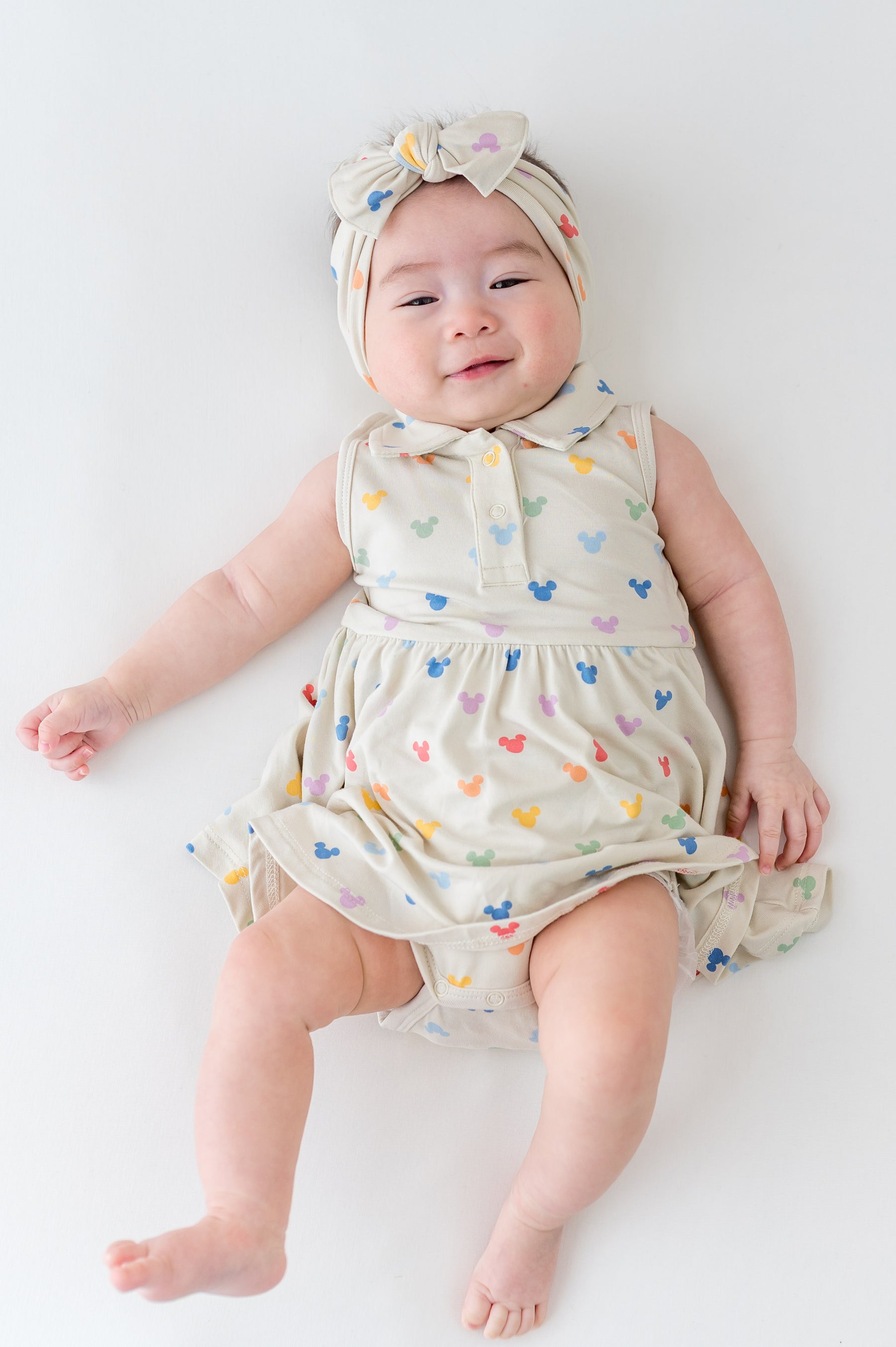 Bamboo Polo Bodysuit Dress in Pastel Mickey Mouse by Kyte Baby Bamboo Polo Bodysuit Dress in Pastel Mickey Mouse by Kyte Baby