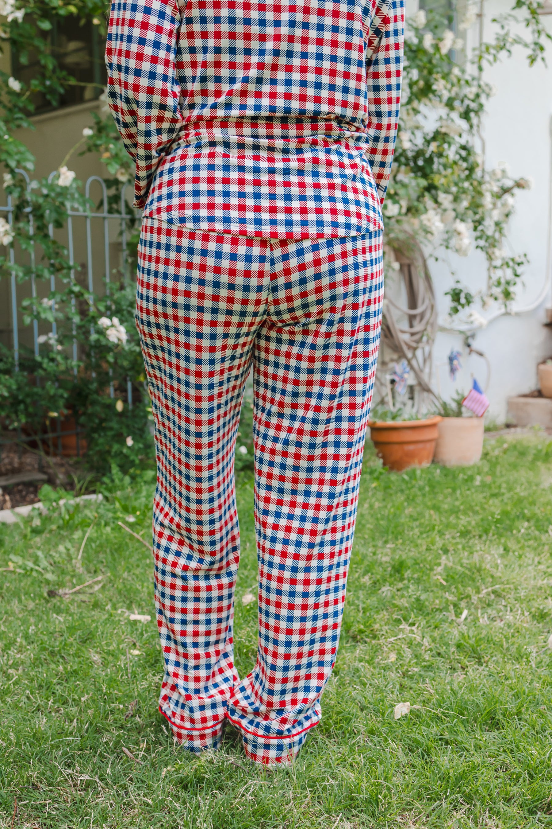 Back side of Long sleeve pajama set in red white and blue Patriotic Gingham check print outdoors