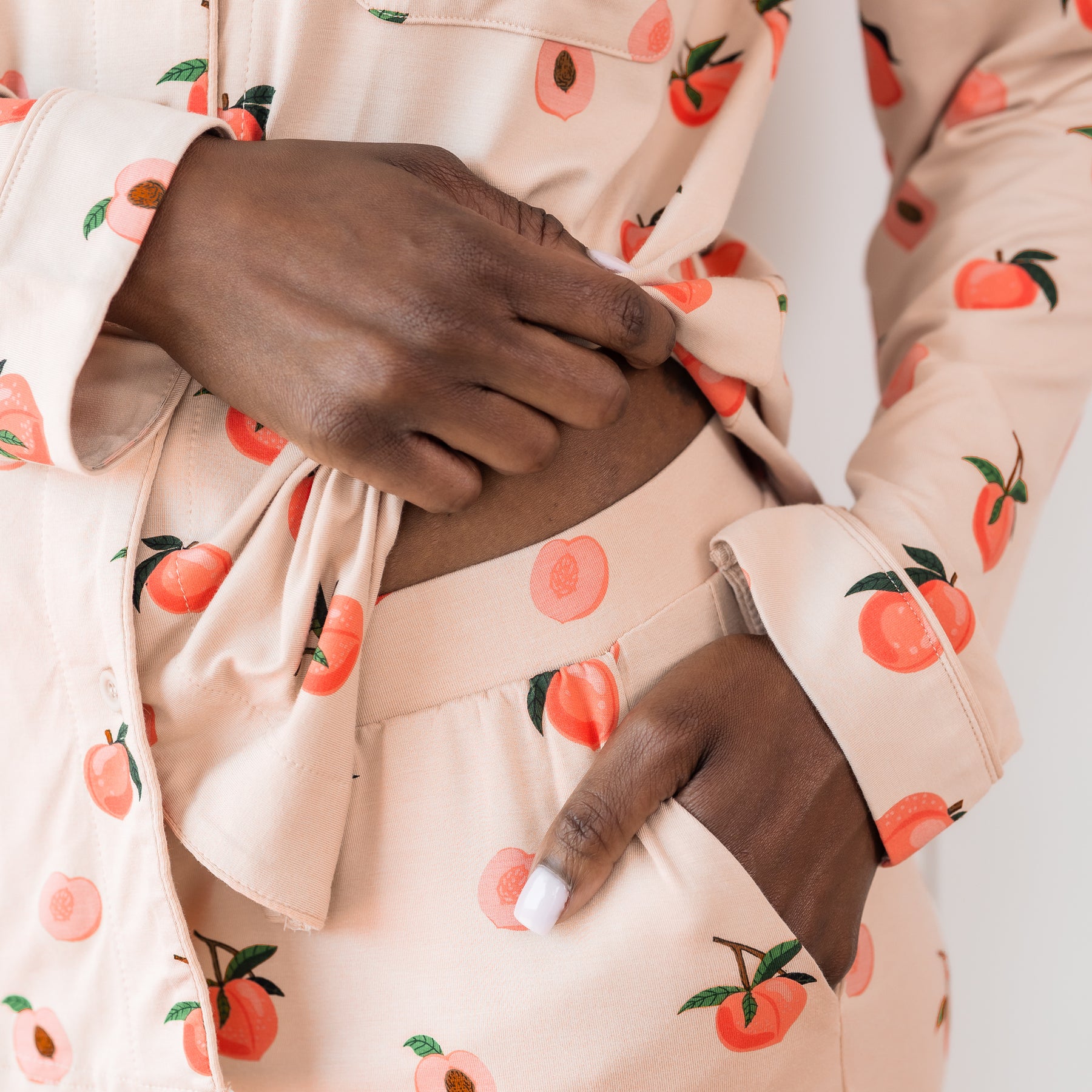 Woman wearing pajama set in a peach print