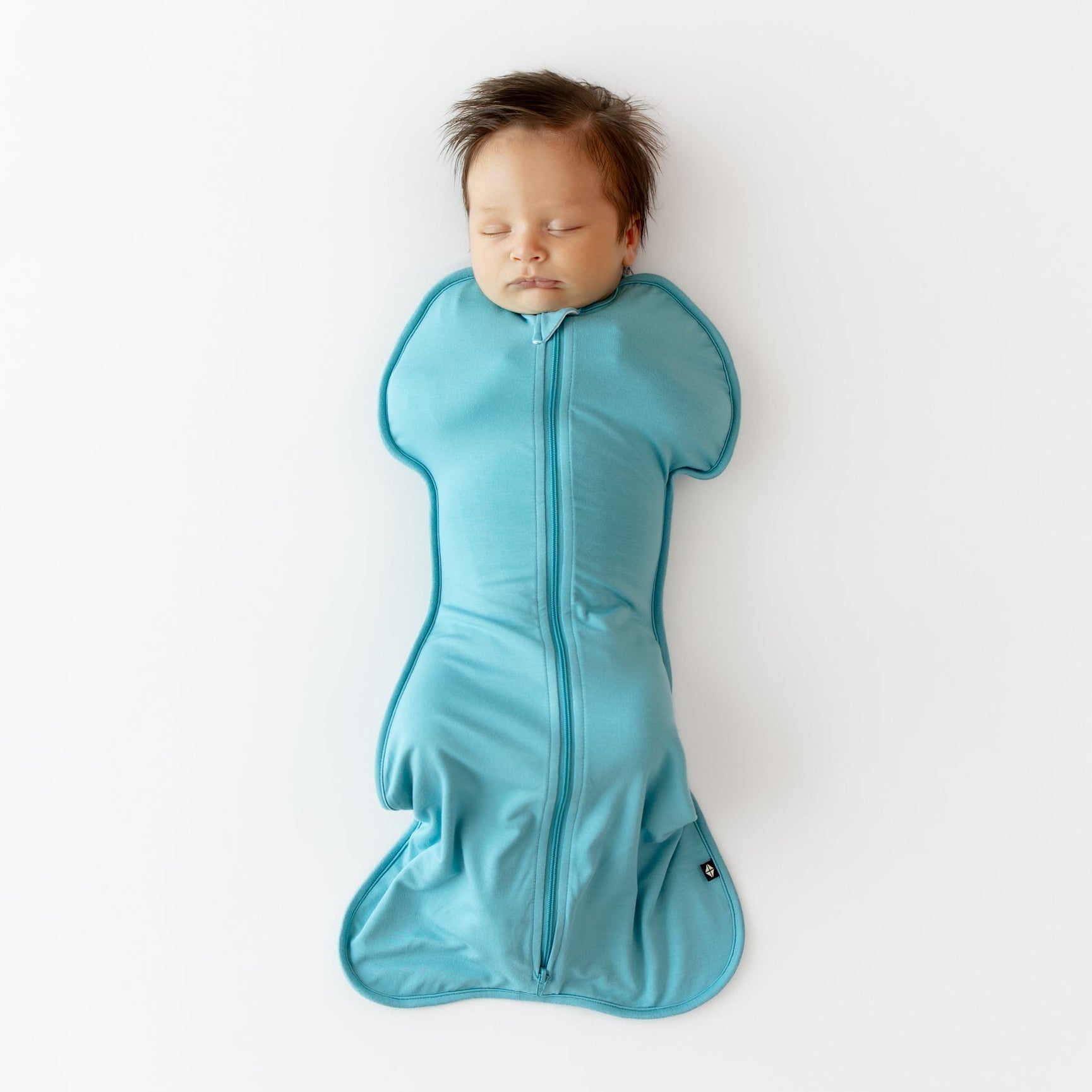 Baby sleeping in Swaddle Bag in Makai 0.5