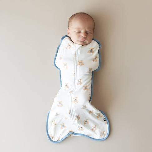 Baby sleeping in Kyte Baby Swaddle Bag in Teddy Bear 0.5