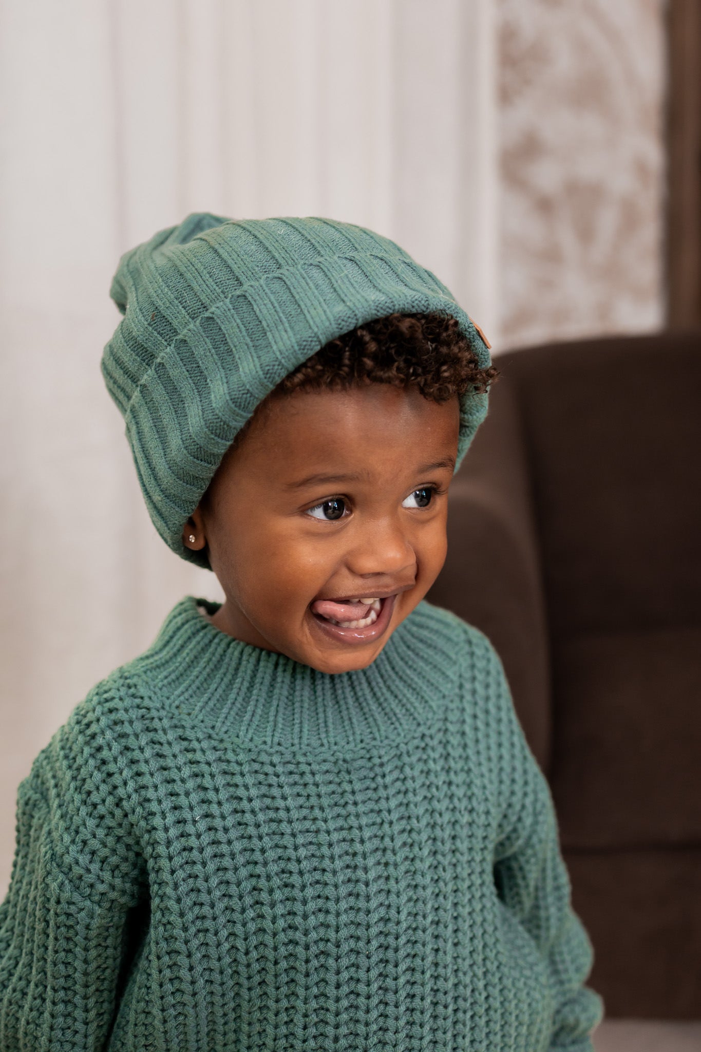 Boy wearing Chunky knit sweater with chunky knit ribbed beanie in Pine
