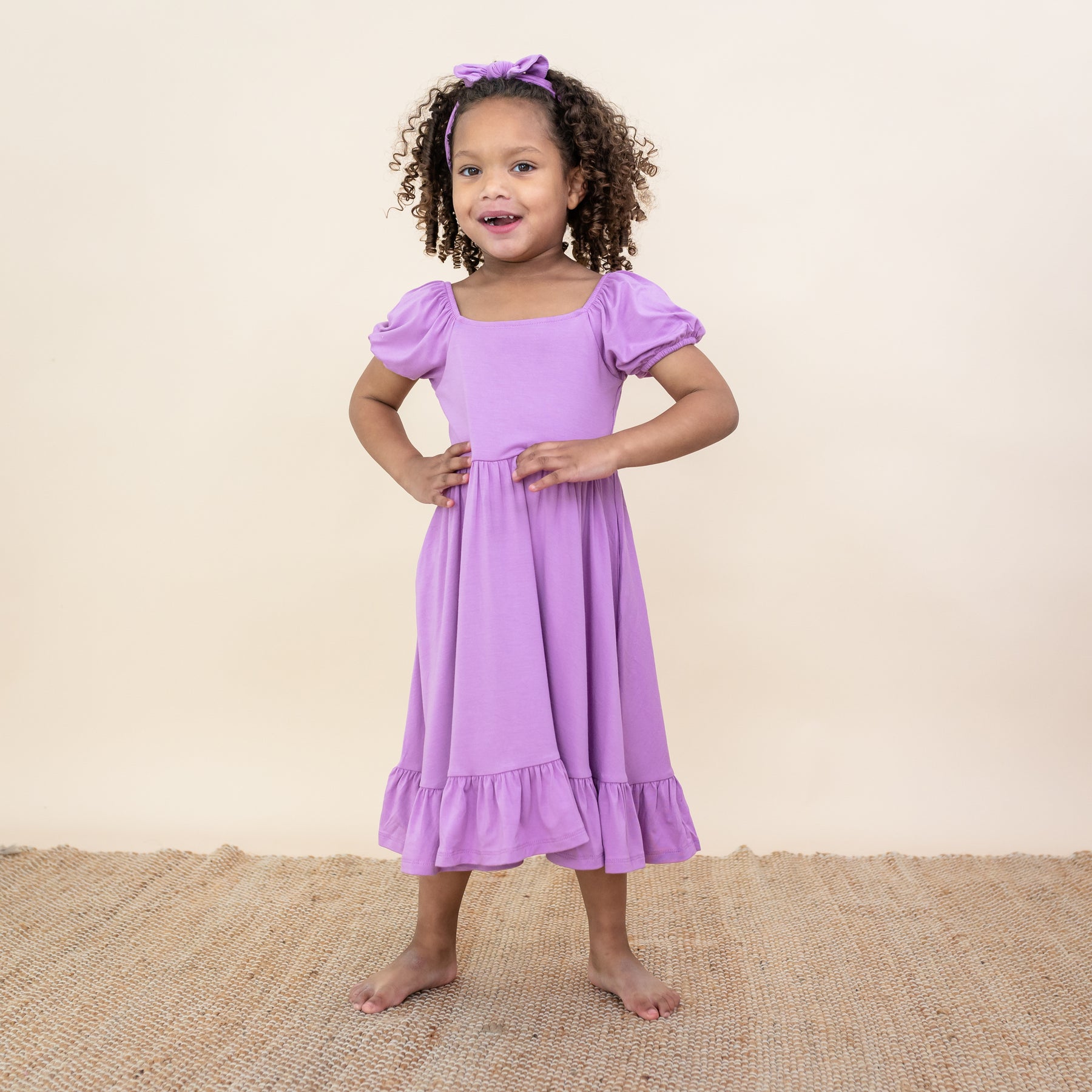 Toddler modeling Puff Sleeve Twirl Dress in Poi