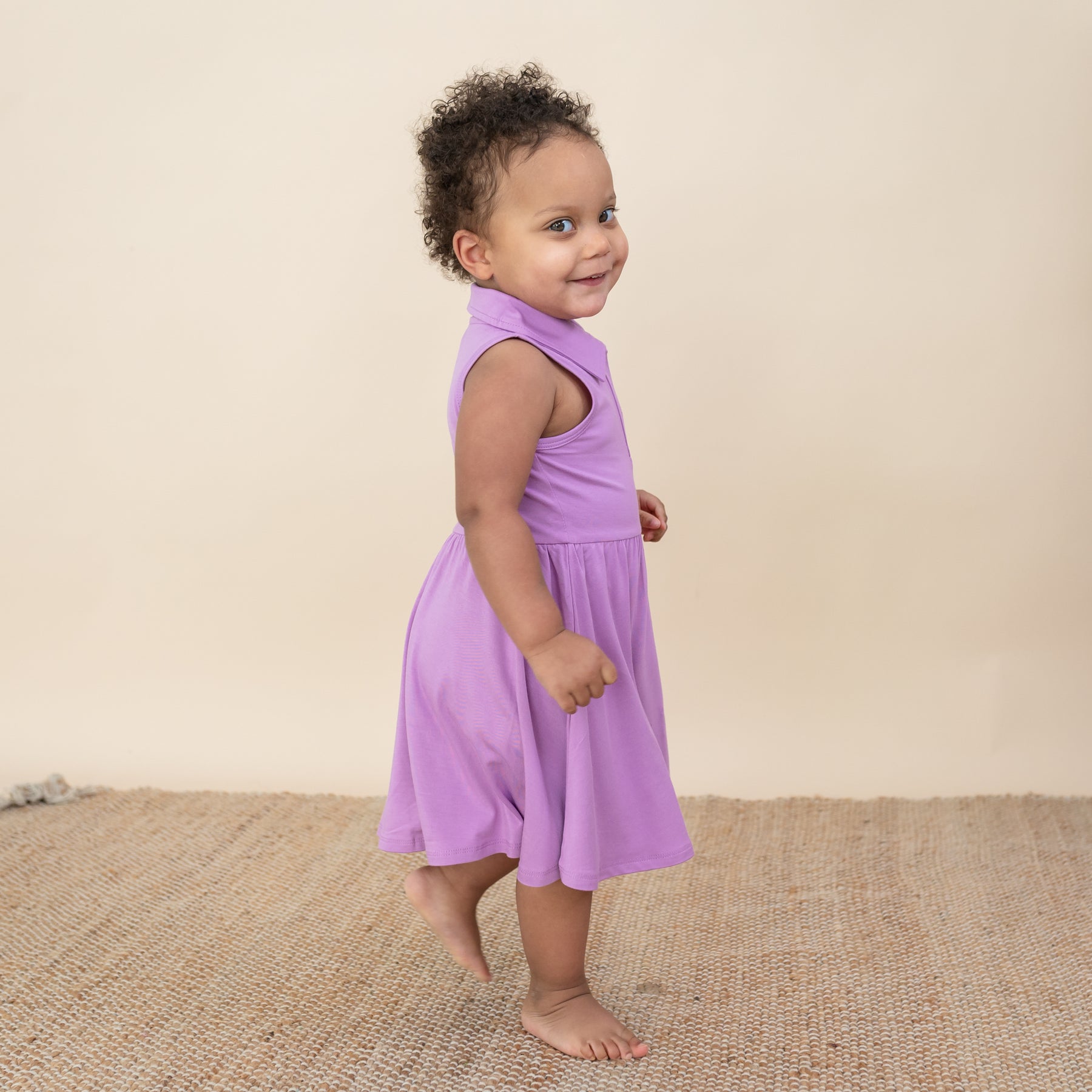 Toddler modeling Polo Bodysuit Dress in Poi