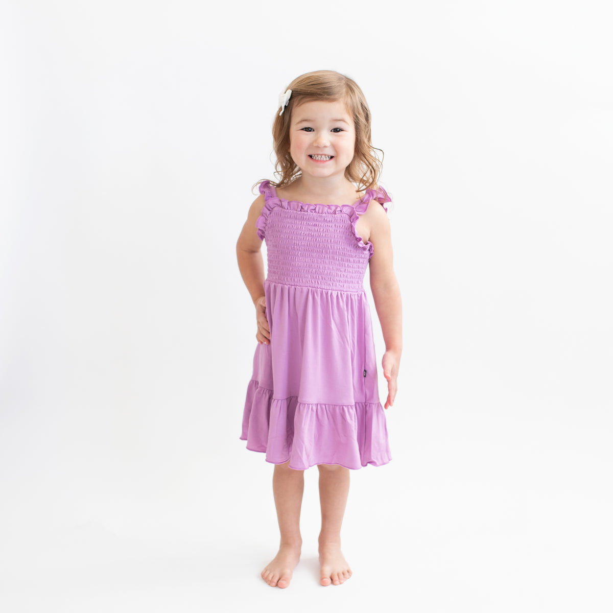 purple smocked dress Bamboo Smocked Dress in Poi Purple by Kyte Baby