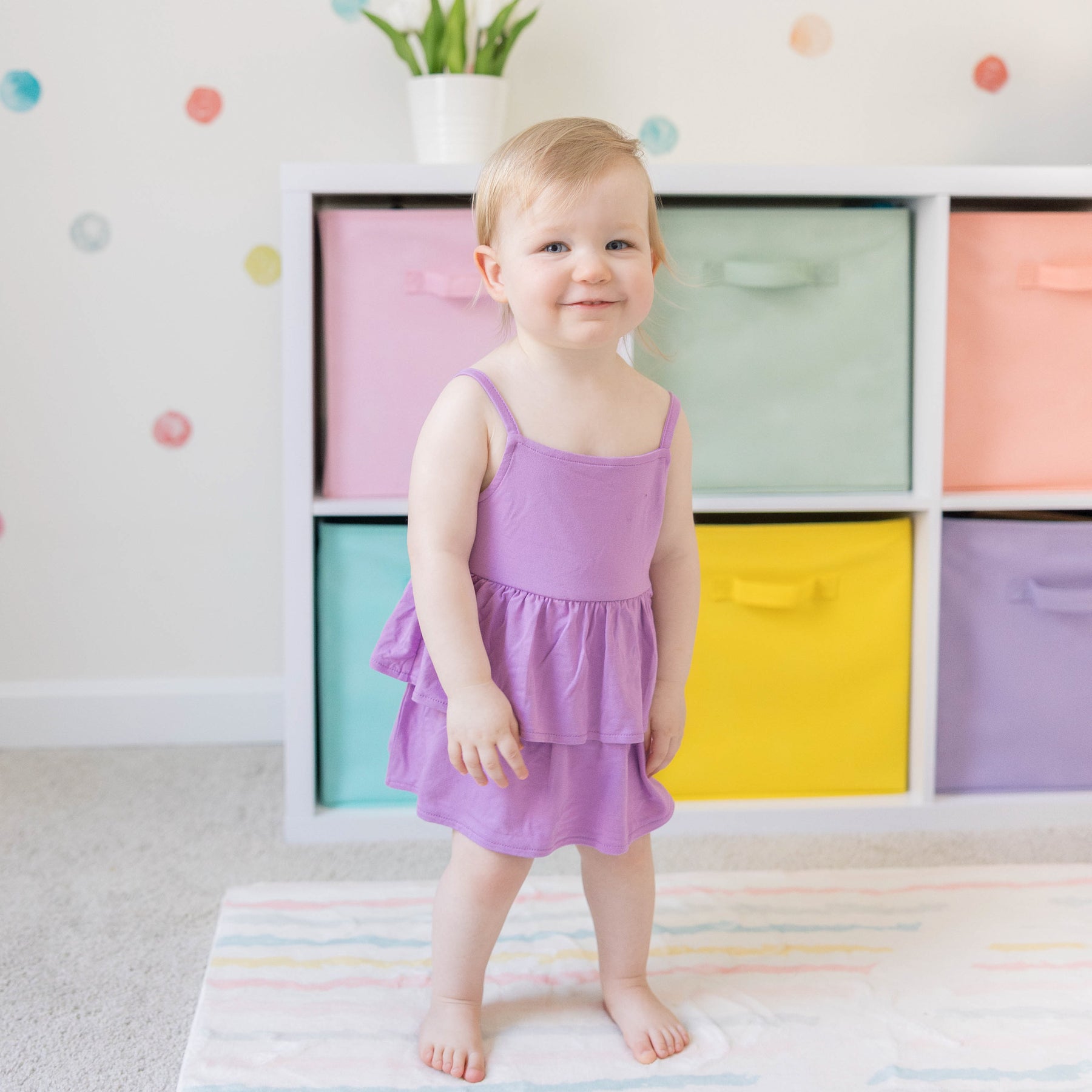 Toddler modeling Spaghetti Strap Ruffle Romper in Poi