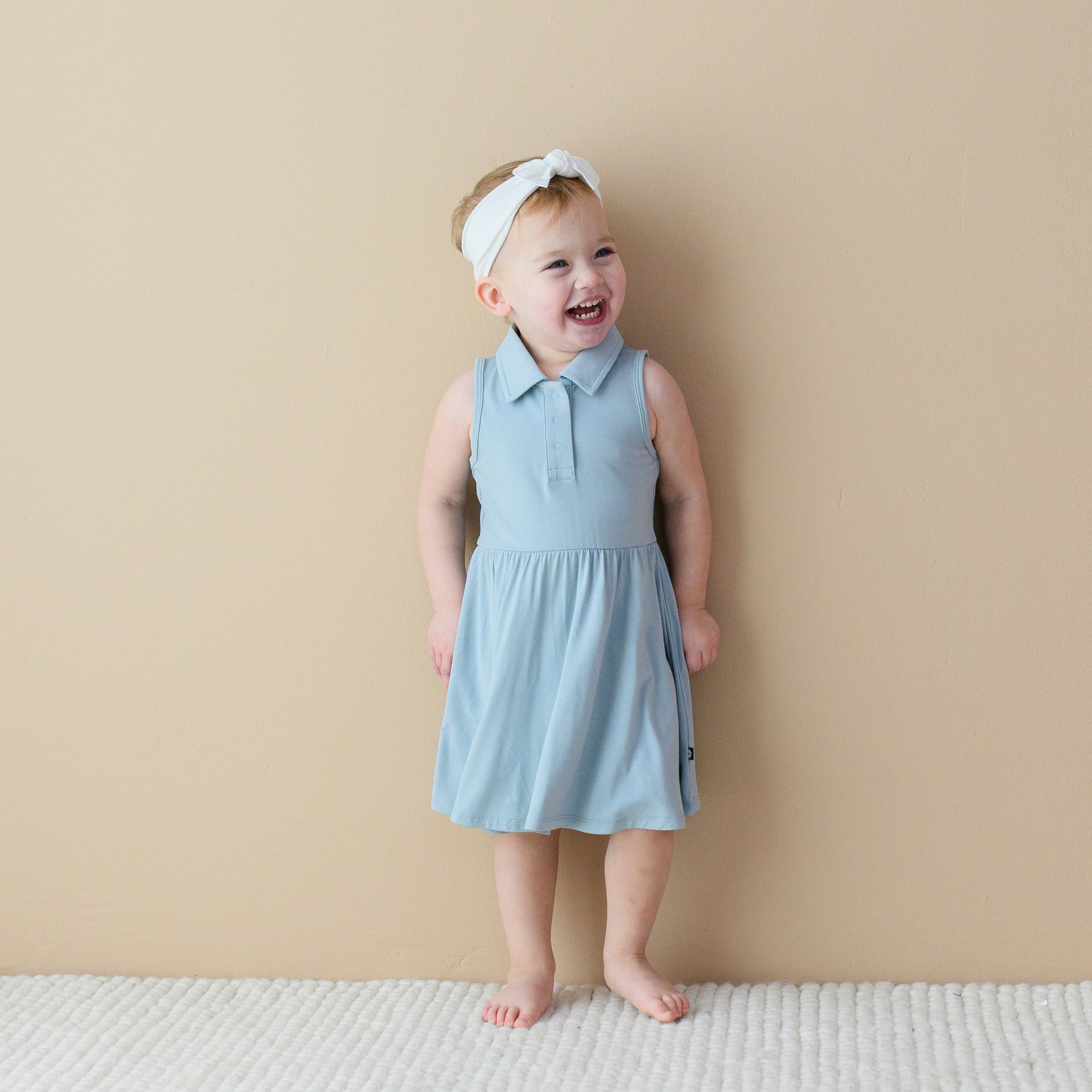 Toddler modeling Polo Bodysuit Dress in Fog