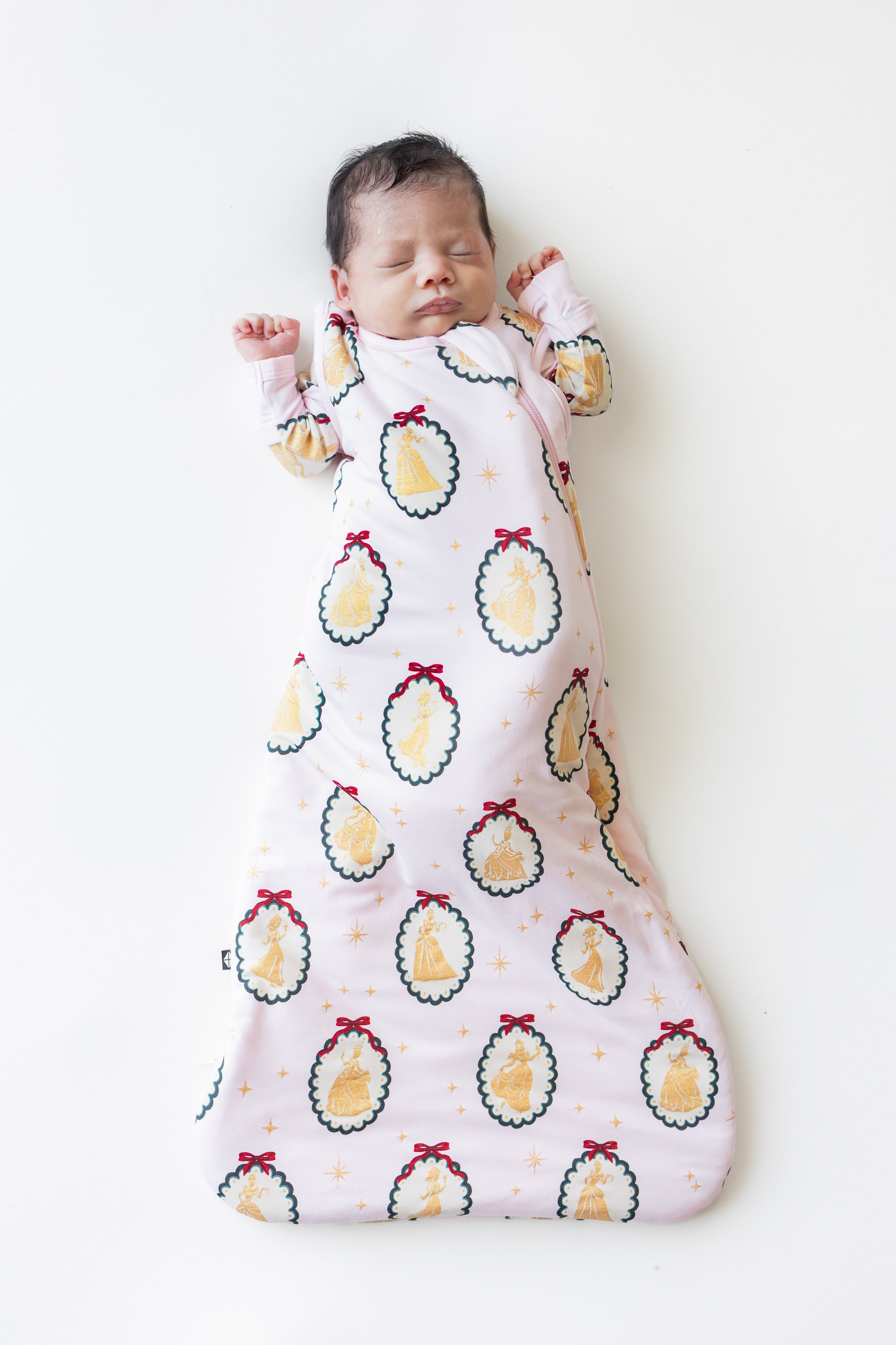 Baby sleeping in Sleep Bag in Princess Holiday Portraits 1.0 print on a beige background