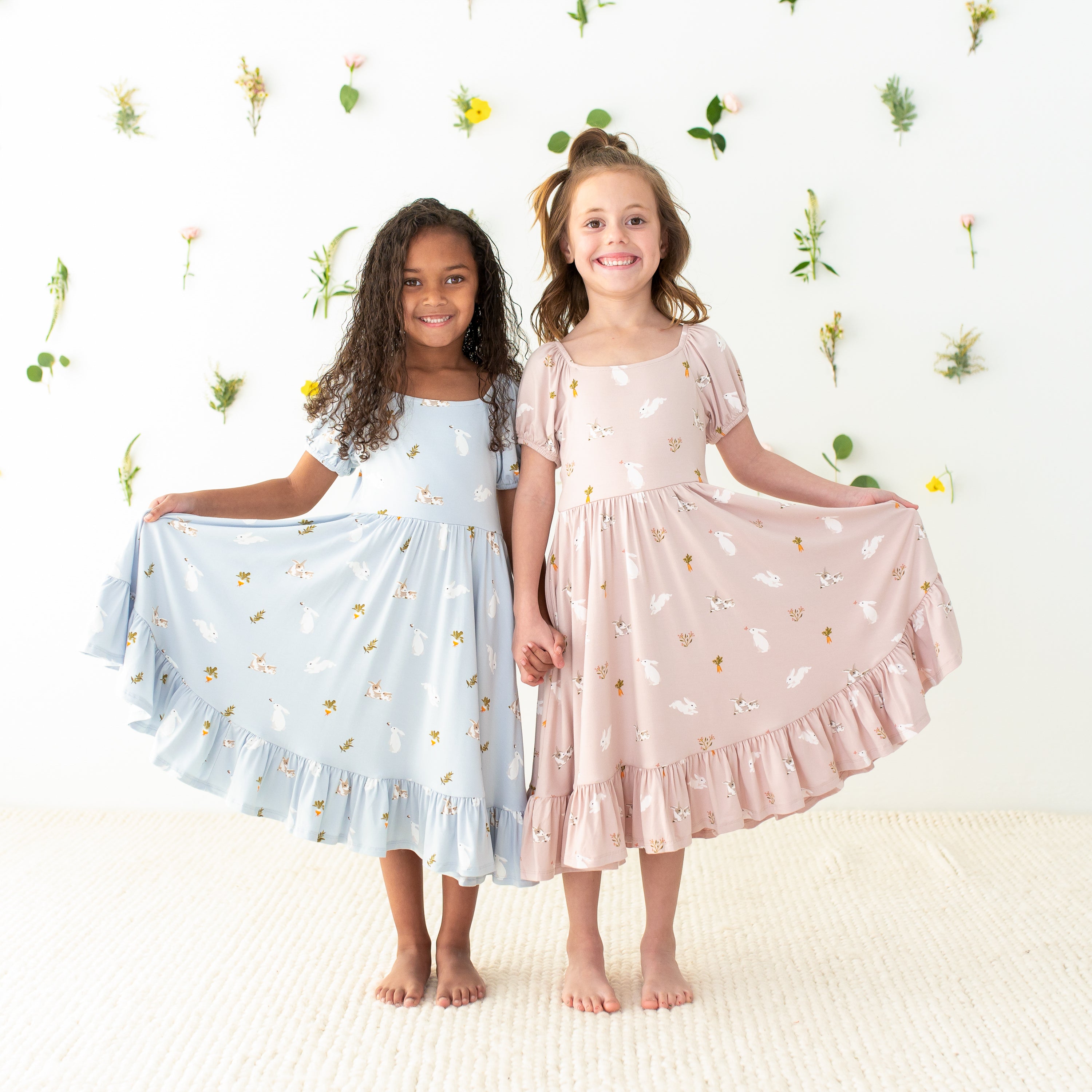 2 children modeling puff sleeve twirl dresses in rabbit prints