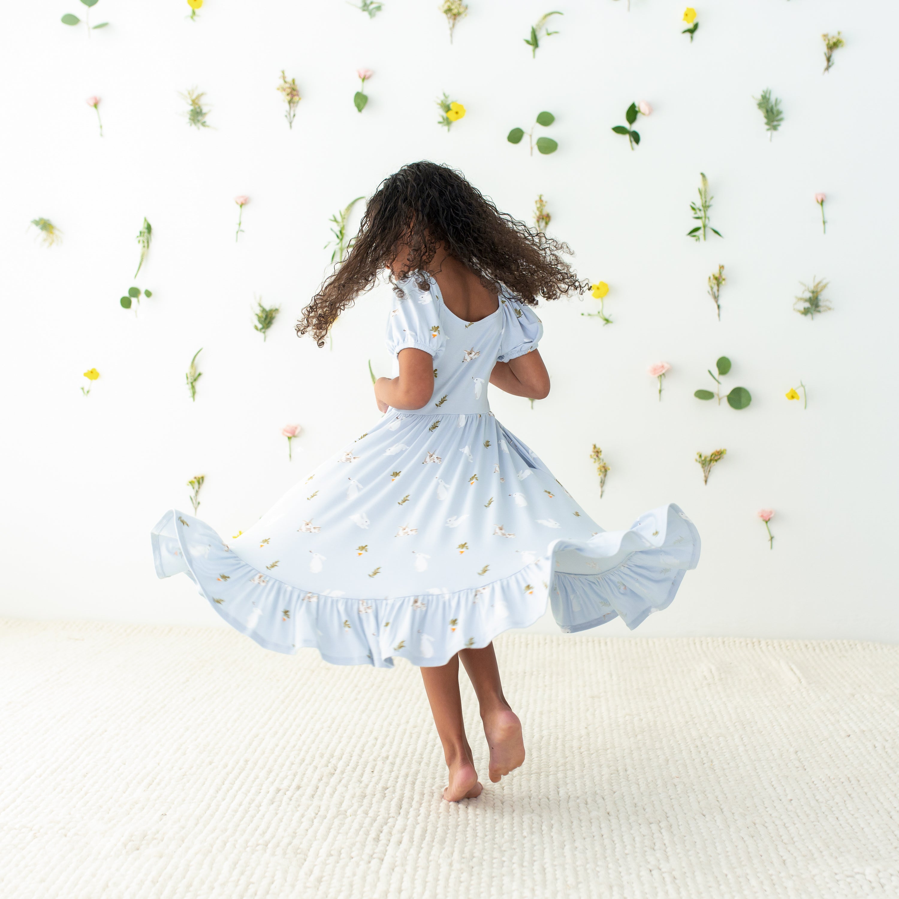 Child twirling in Puff Sleeve Twirl Dress in Ice Rabbit