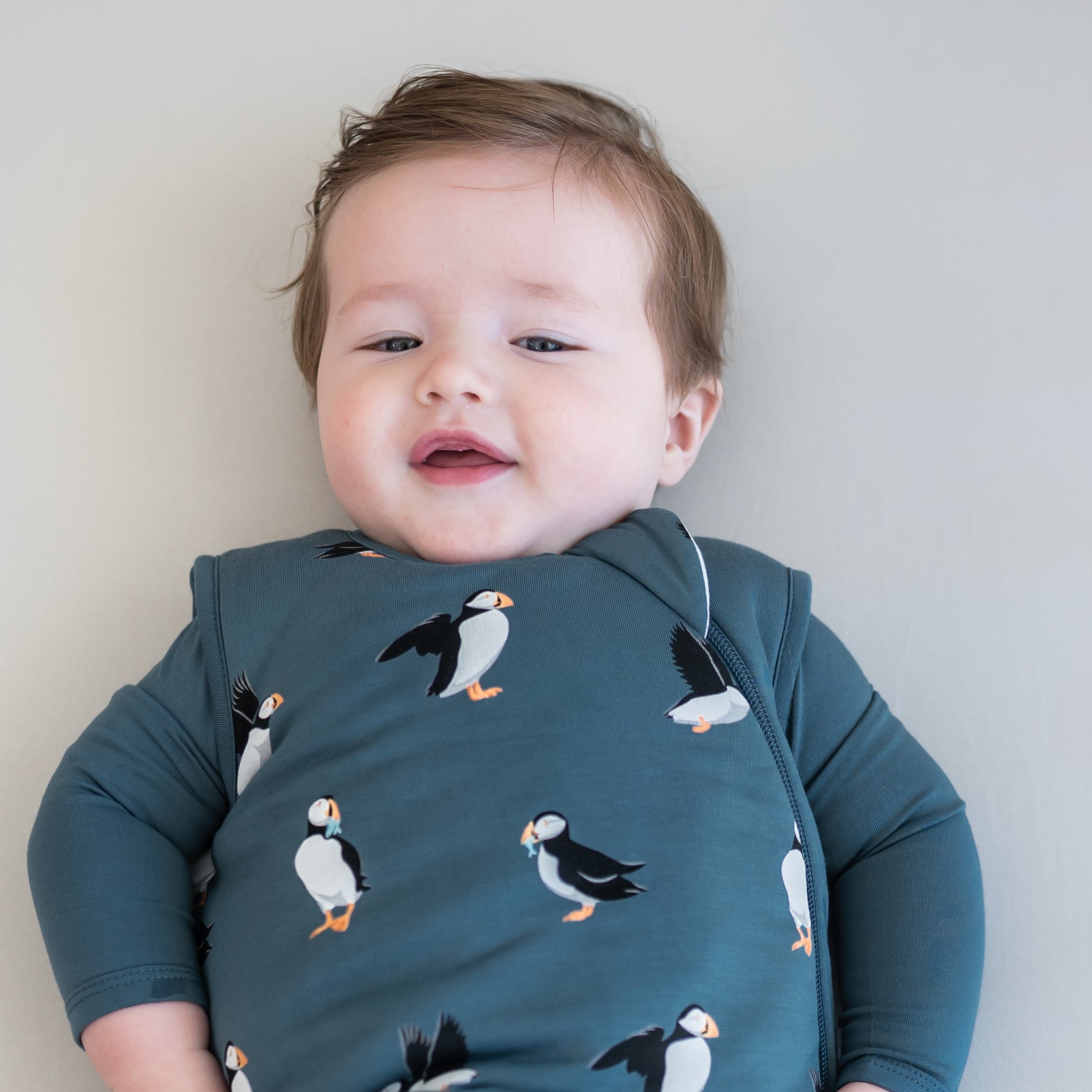 Close up of a toddler wearing the Sleep Bag in Puffin 2.5