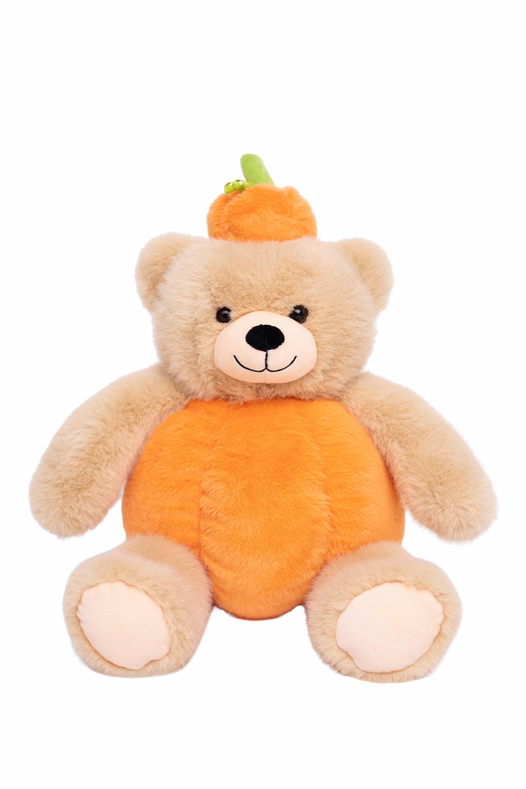 A plush teddy bear dressed as a pumpkin, featuring a beige body, a bright orange pumpkin-shaped belly, and a small orange hat with a green stem, set against a plain white background.