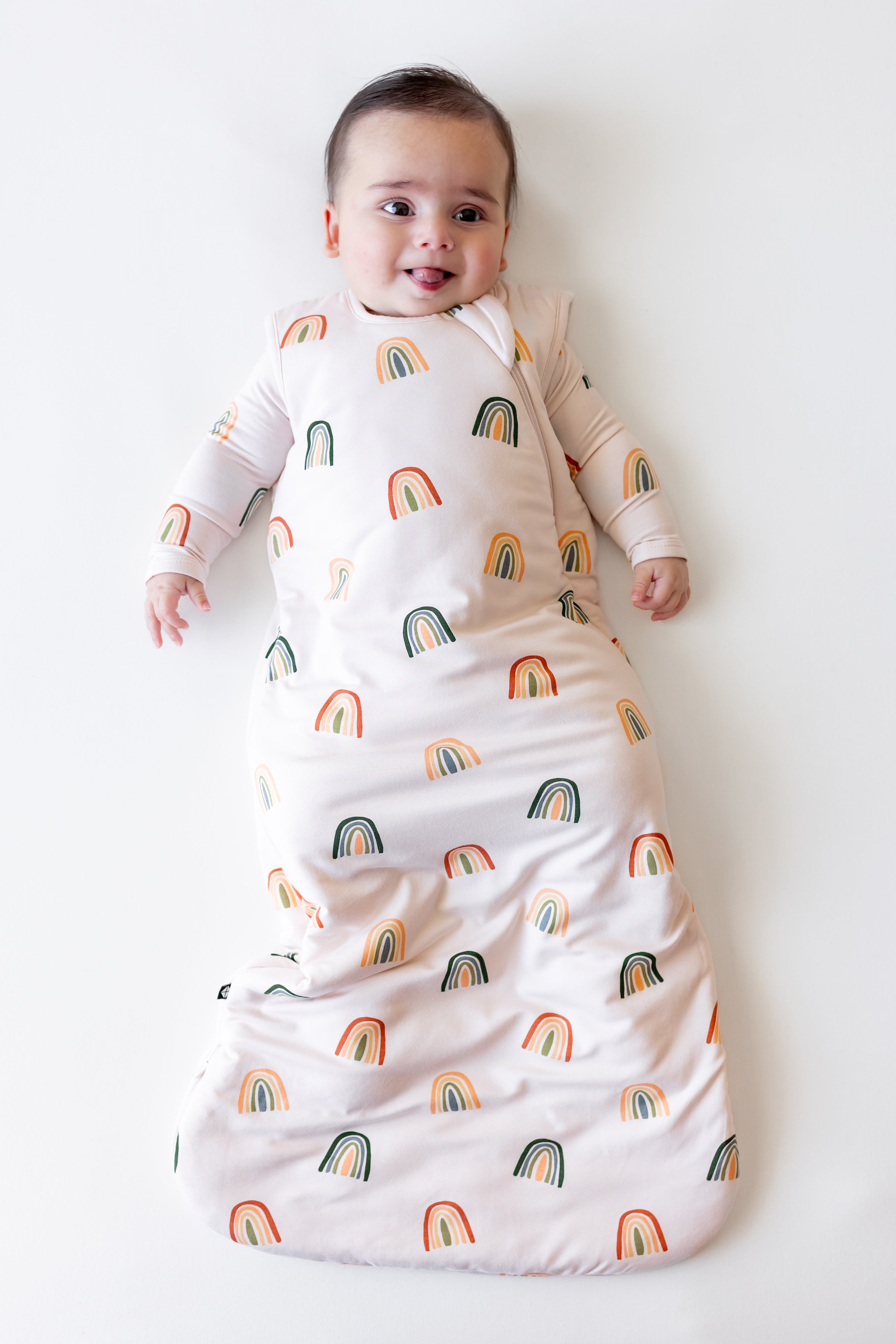 Baby in Sleep Bag in Retro Rainbow 1.0 print on a white background