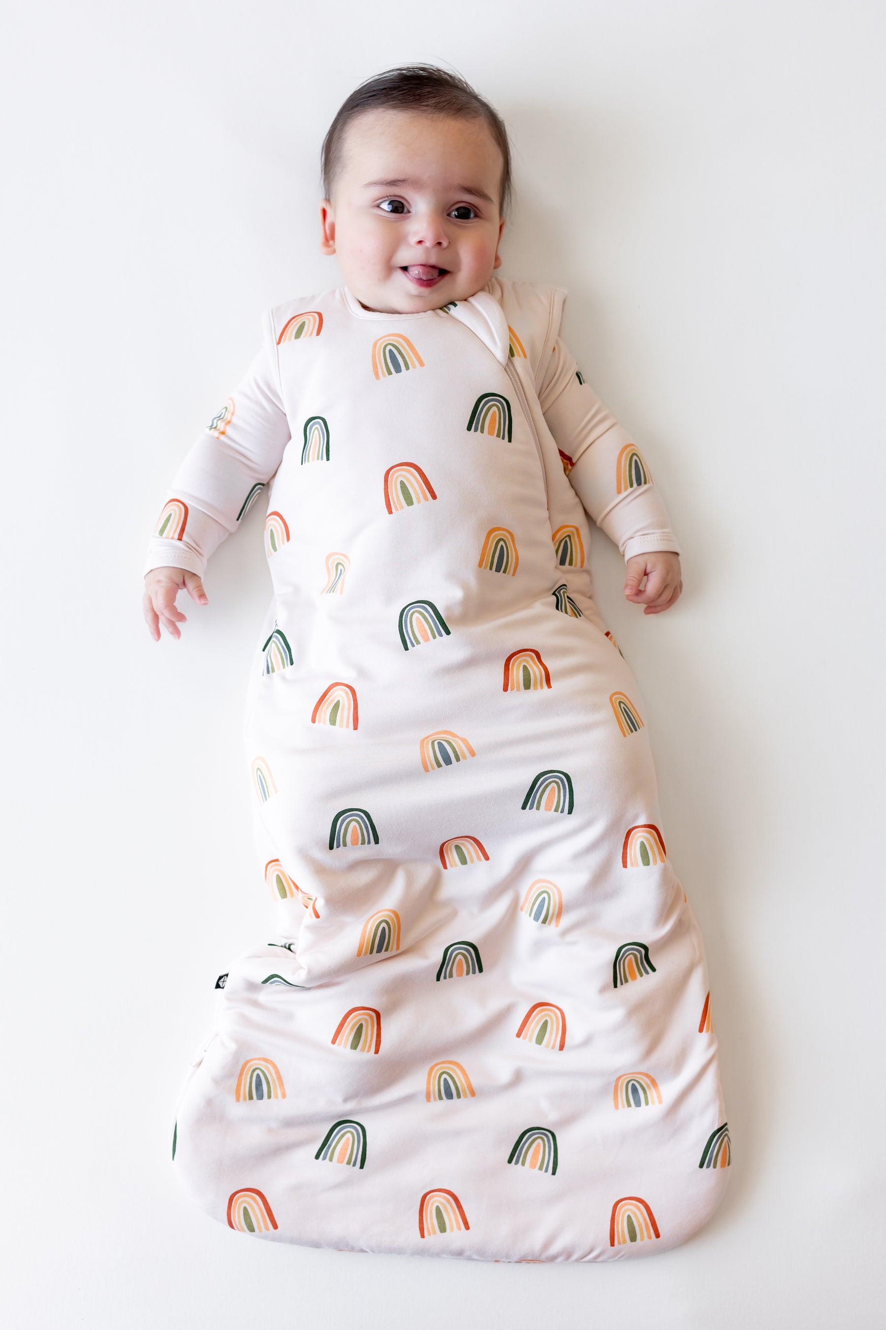 Baby in Sleep Bag in Retro Rainbow 1.0 print on a white background
