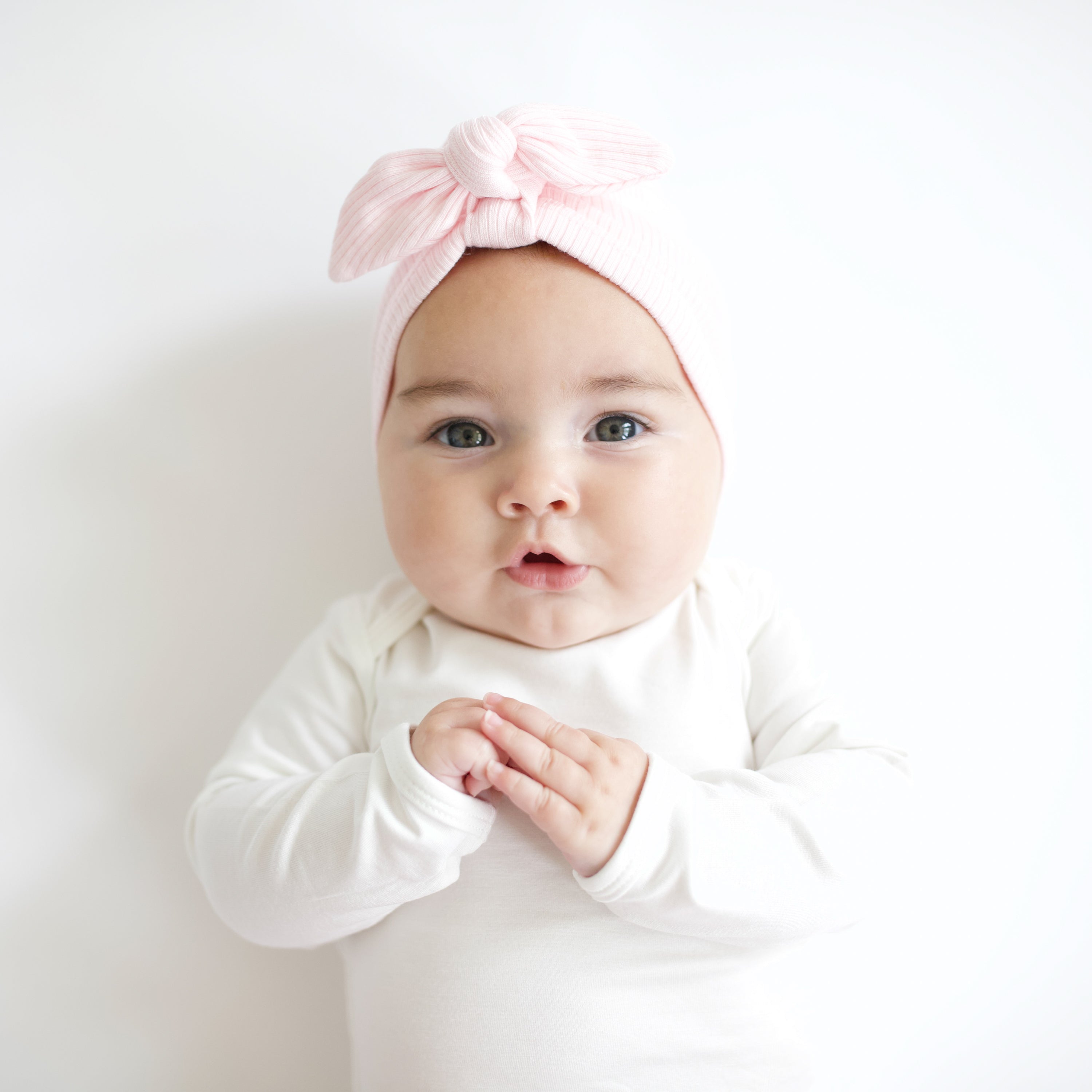 Baby wearing Ribbed Headwrap in Sakura