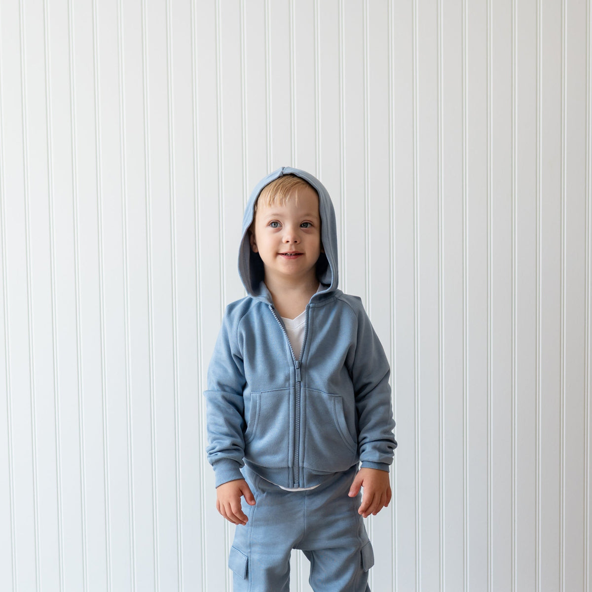 Fleece Zip Up Hoodie in Slate with the hood up shown on a young boy
