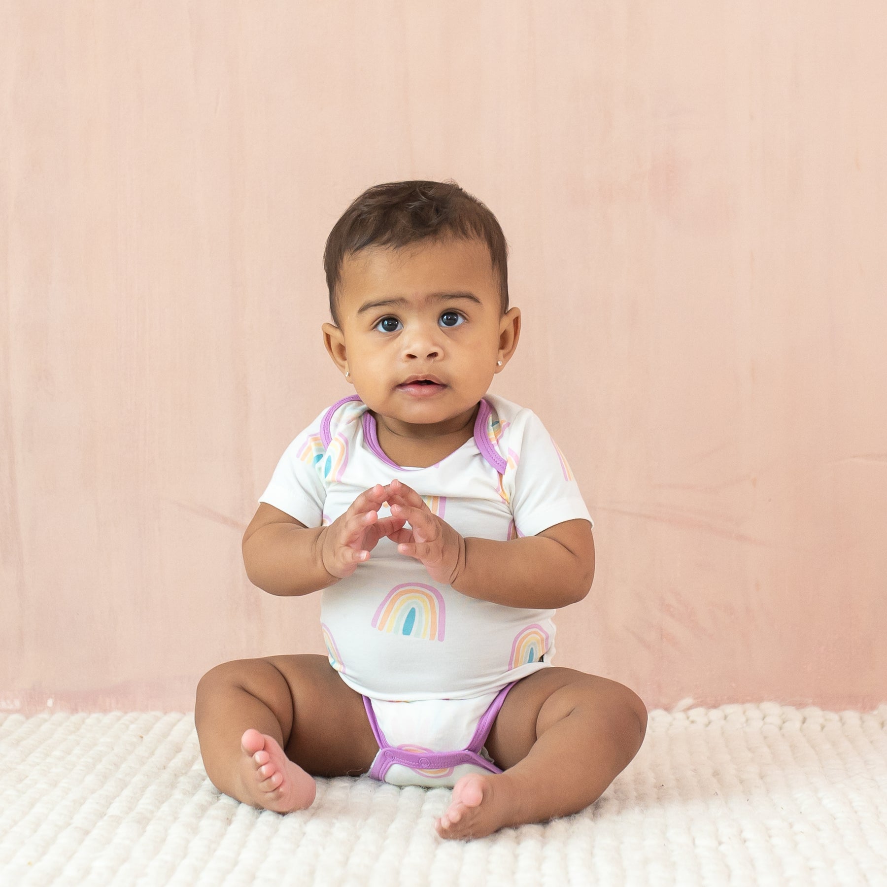 Baby modeling Bodysuit in Poi Rainbow