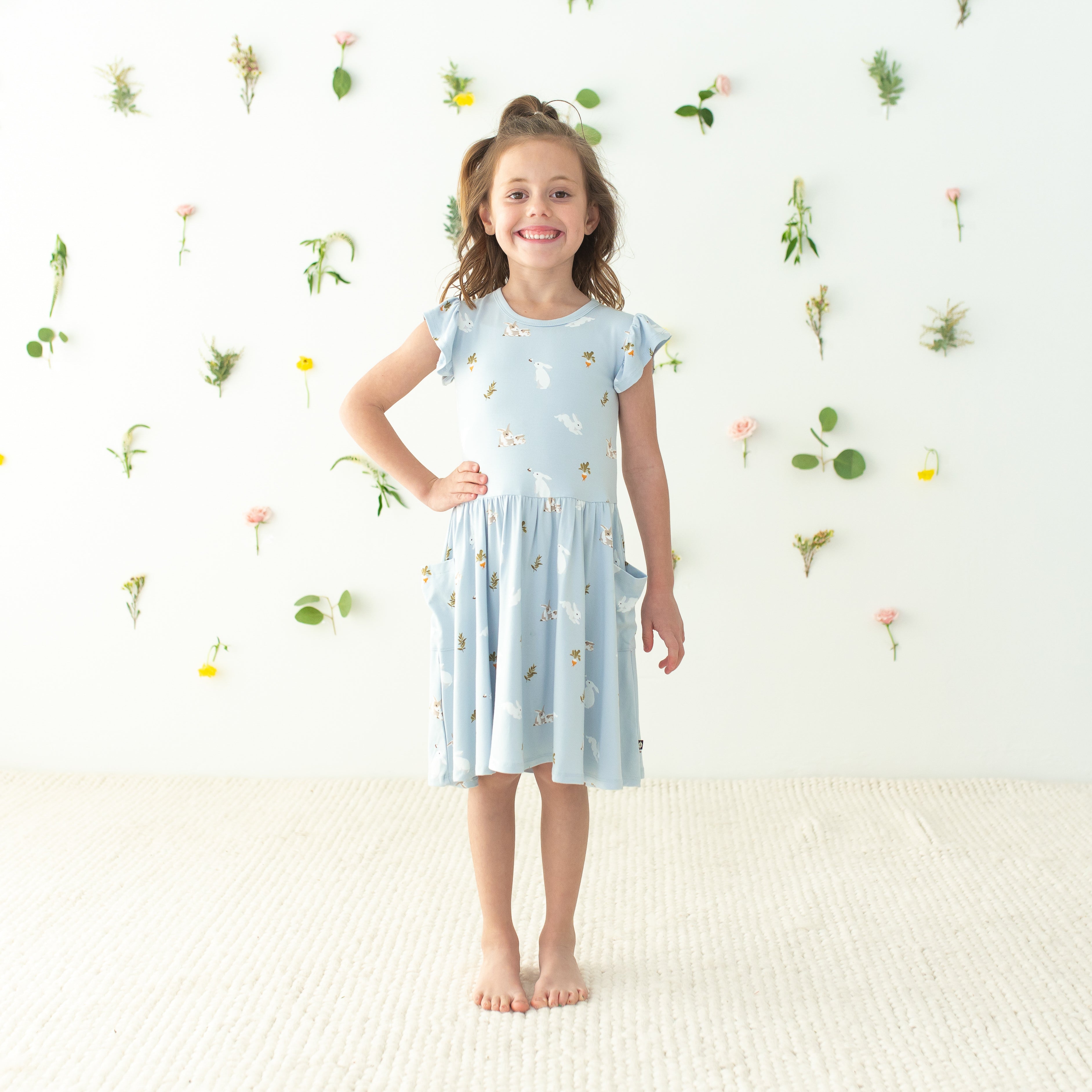 Child modeling Pocket Dress in Ice Rabbit