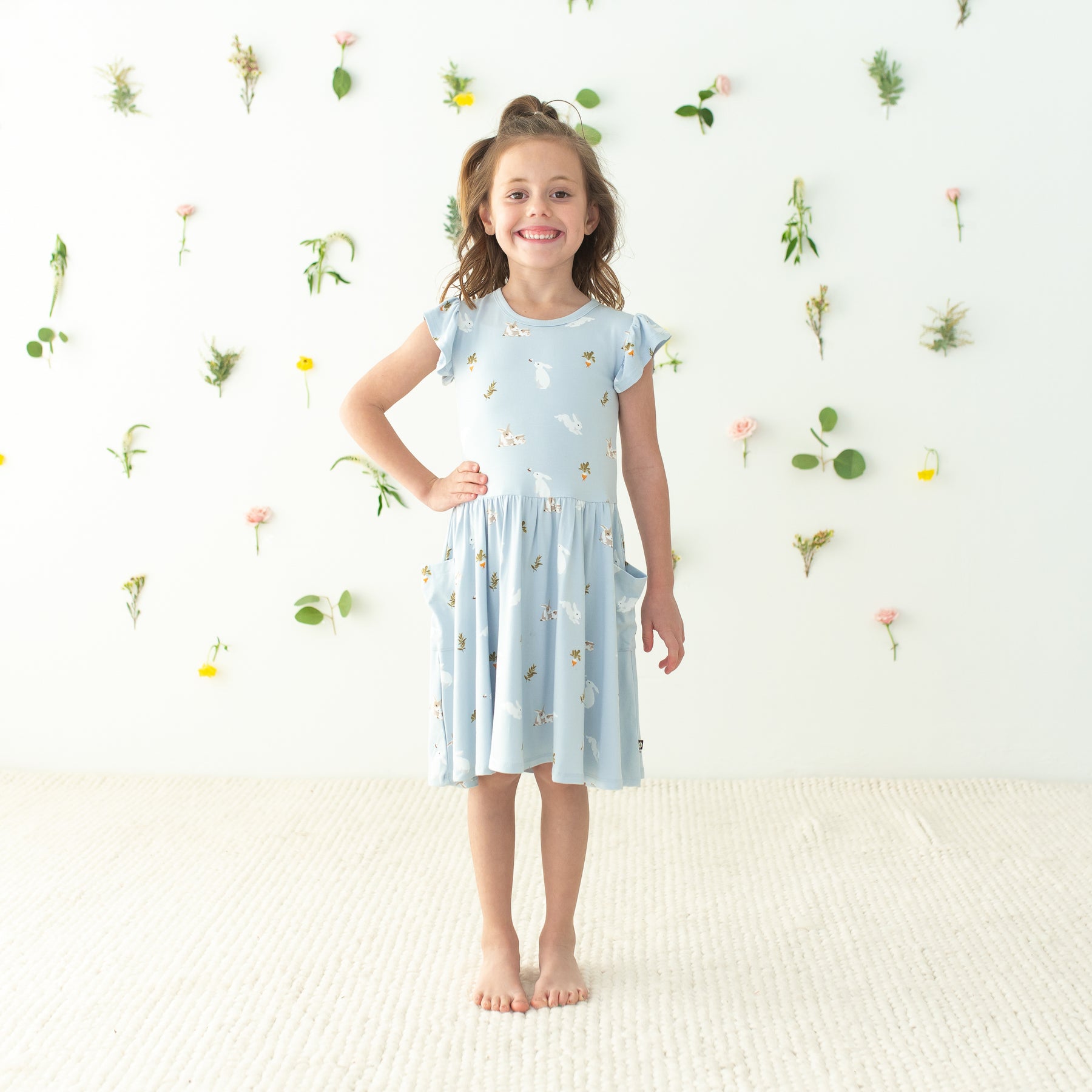 Child modeling Pocket Dress in Ice Rabbit