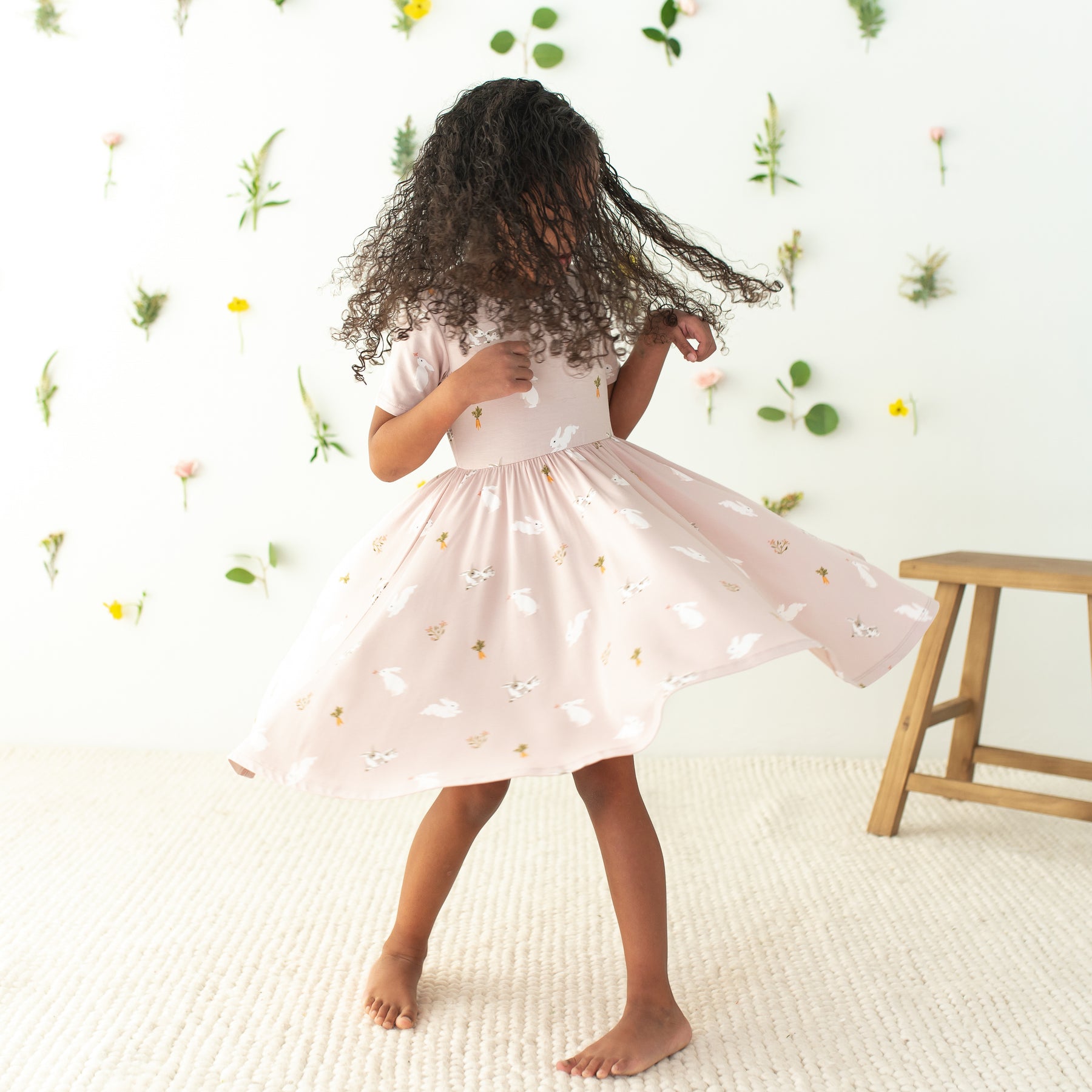 toddler twirling in Twirl Dress in Blush Rabbit