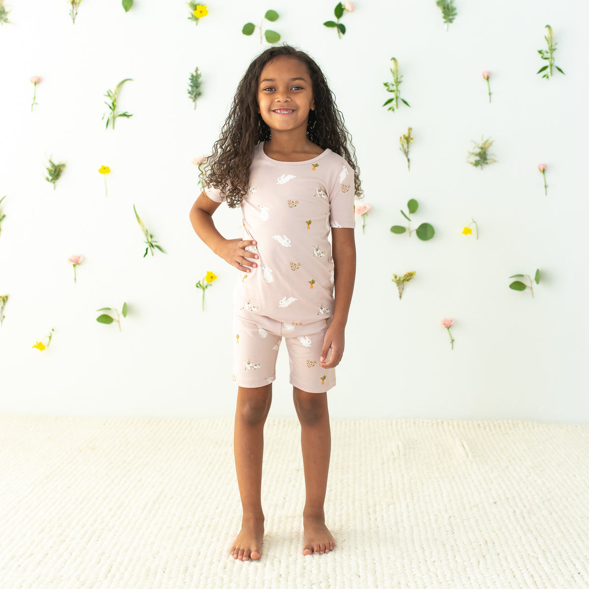 Child modeling Short Sleeve Pajamas in Blush Rabbit