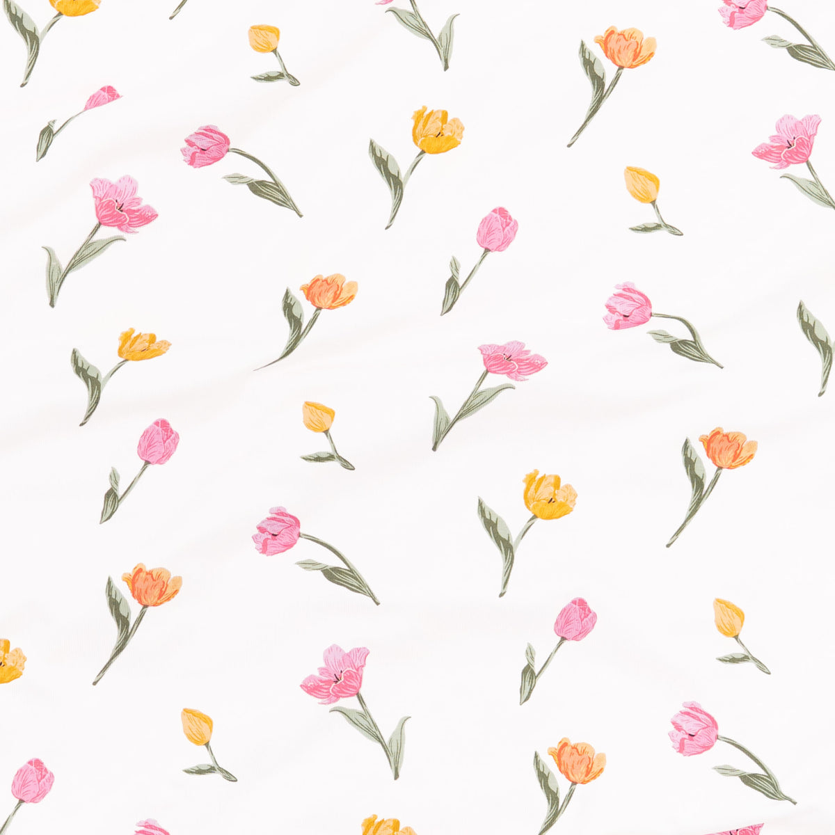 Close up of the fabric swatch of the print tulip showing the yellow, orange and pink tulips with green stems on a white background