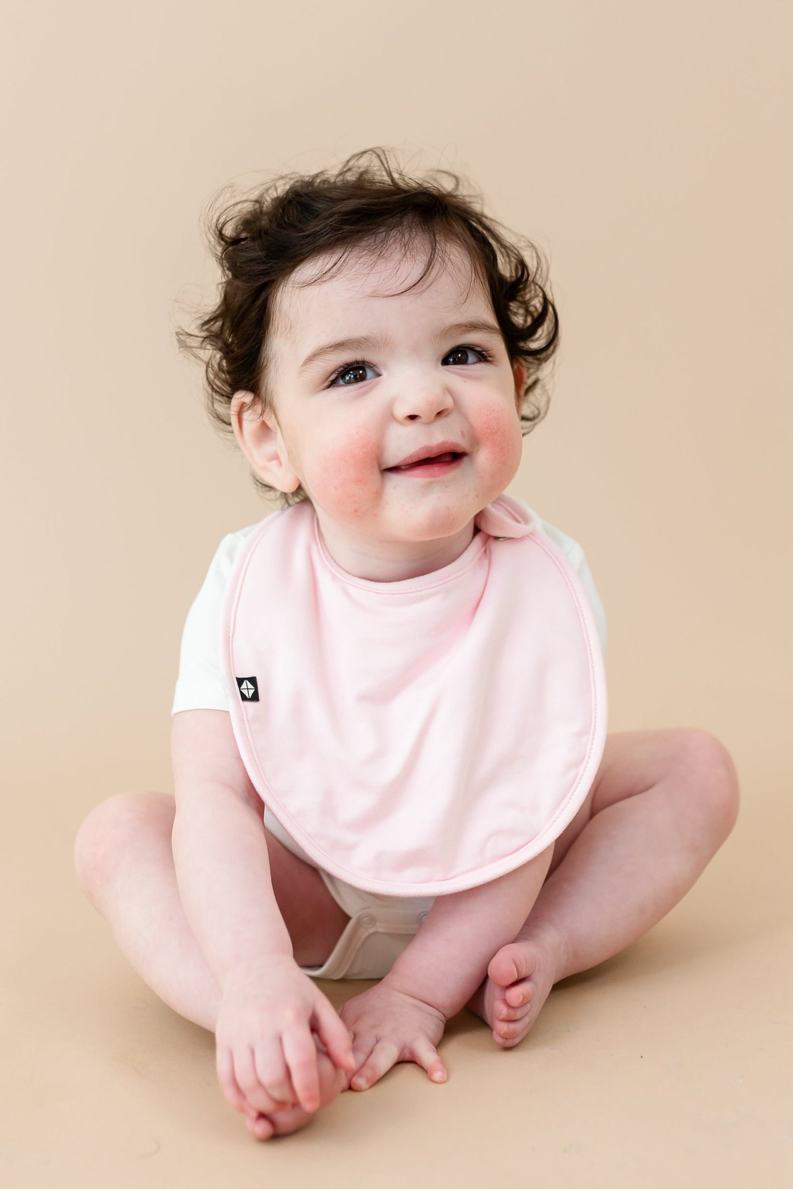 Baby wearing Bamboo Cushy Bib in Sakura