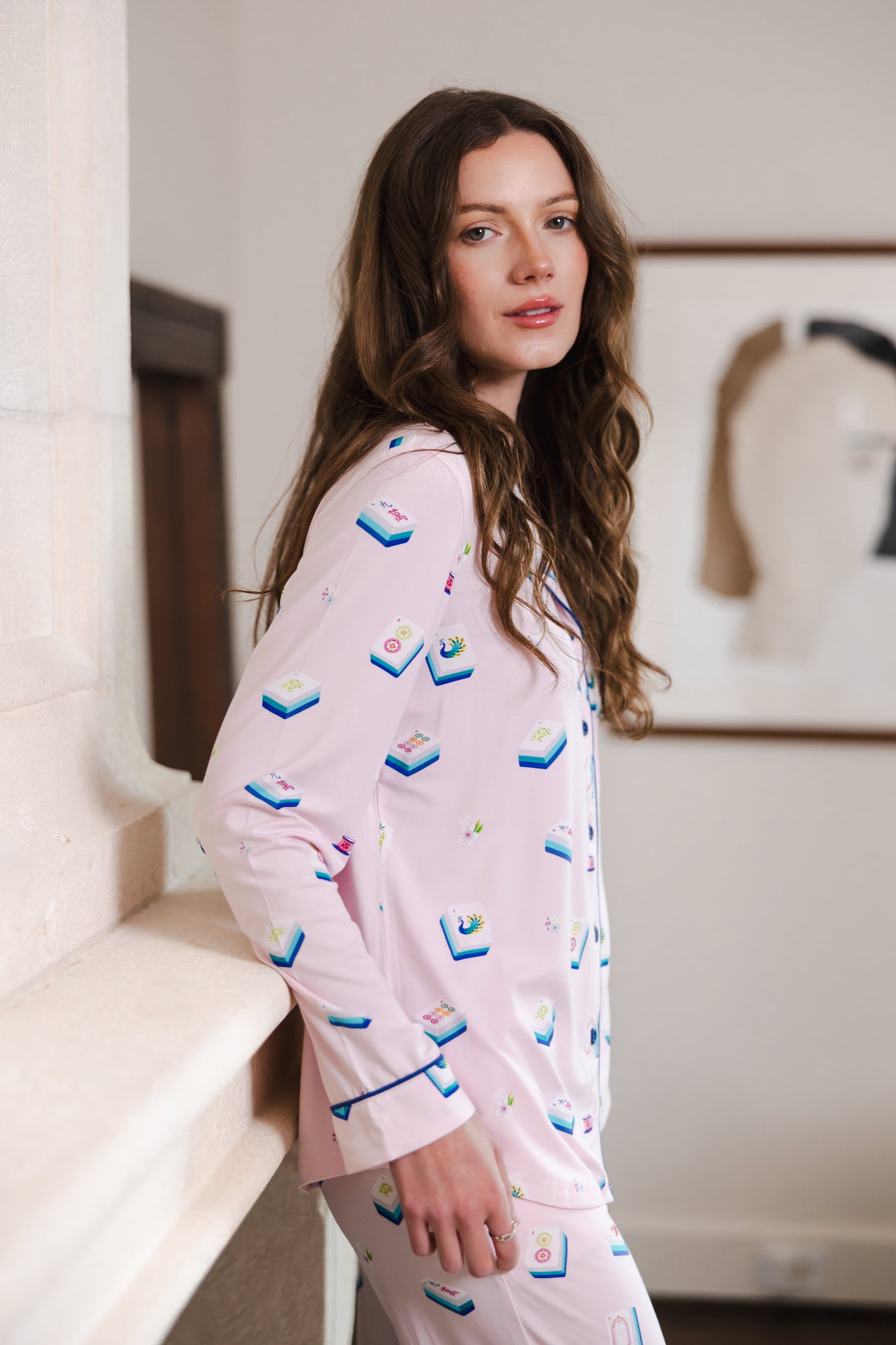 Modal wearing Long-Sleeved Women's Pajama Set in Sakura Mahjong print standing in a room
