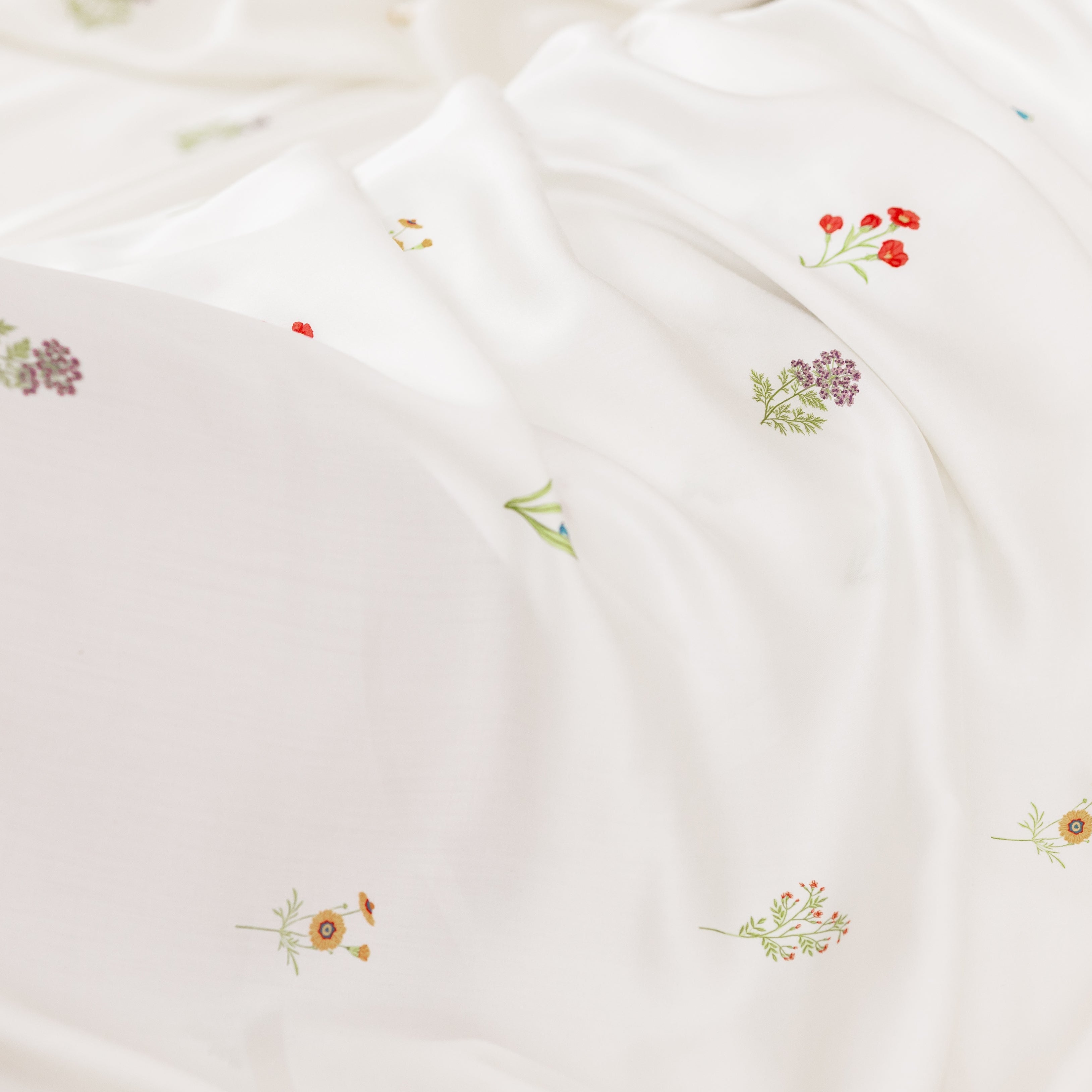 White fabric with small floral pattern