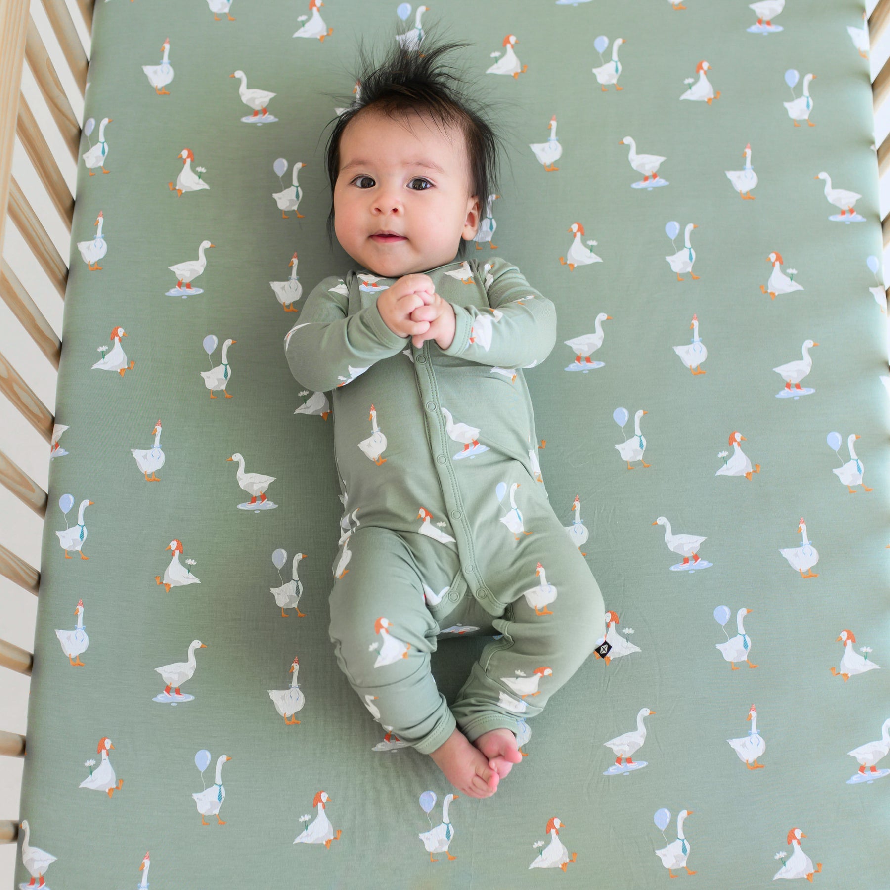 Baby wearing silly goose romper pajamas with snaps